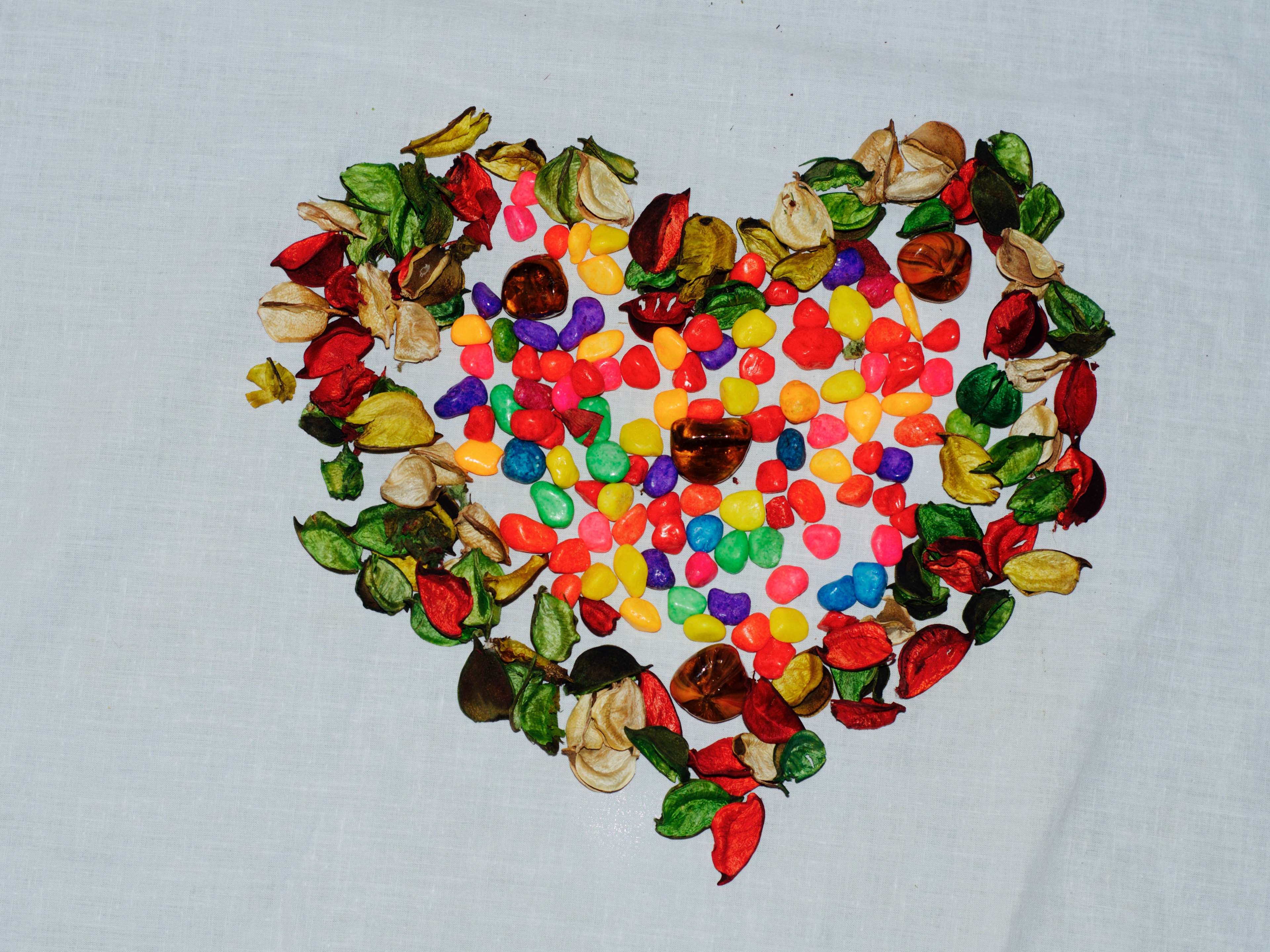 Colorful heart shape made of leaves and stones 4K HD Wallpaper