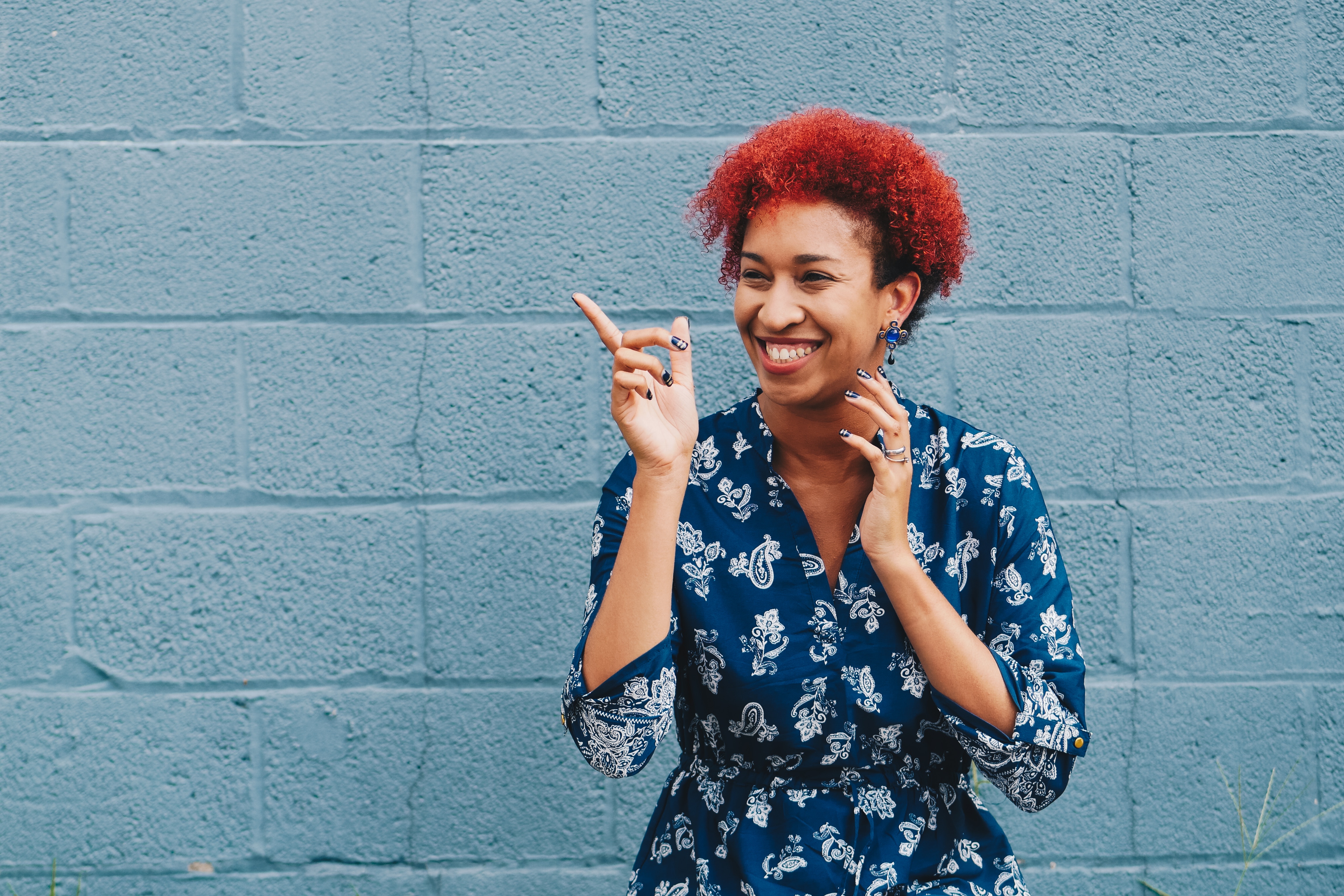 African American woman with red hair pointing HD Wallpaper