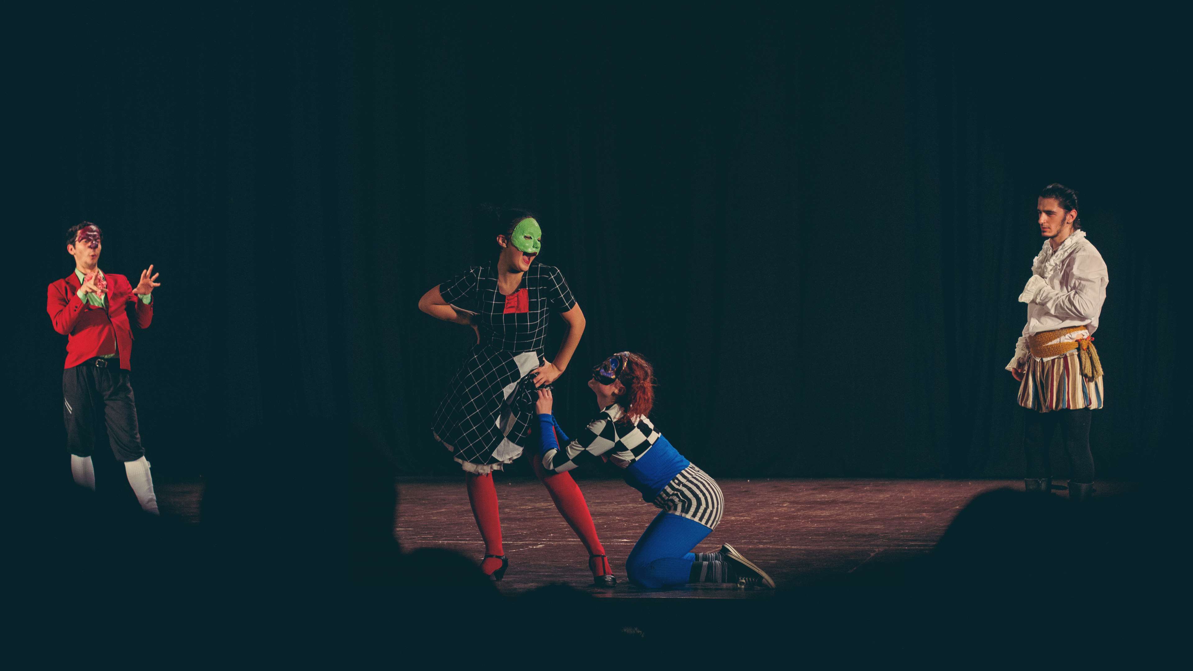 Theater play with masked actors in costumes HD Wallpaper
