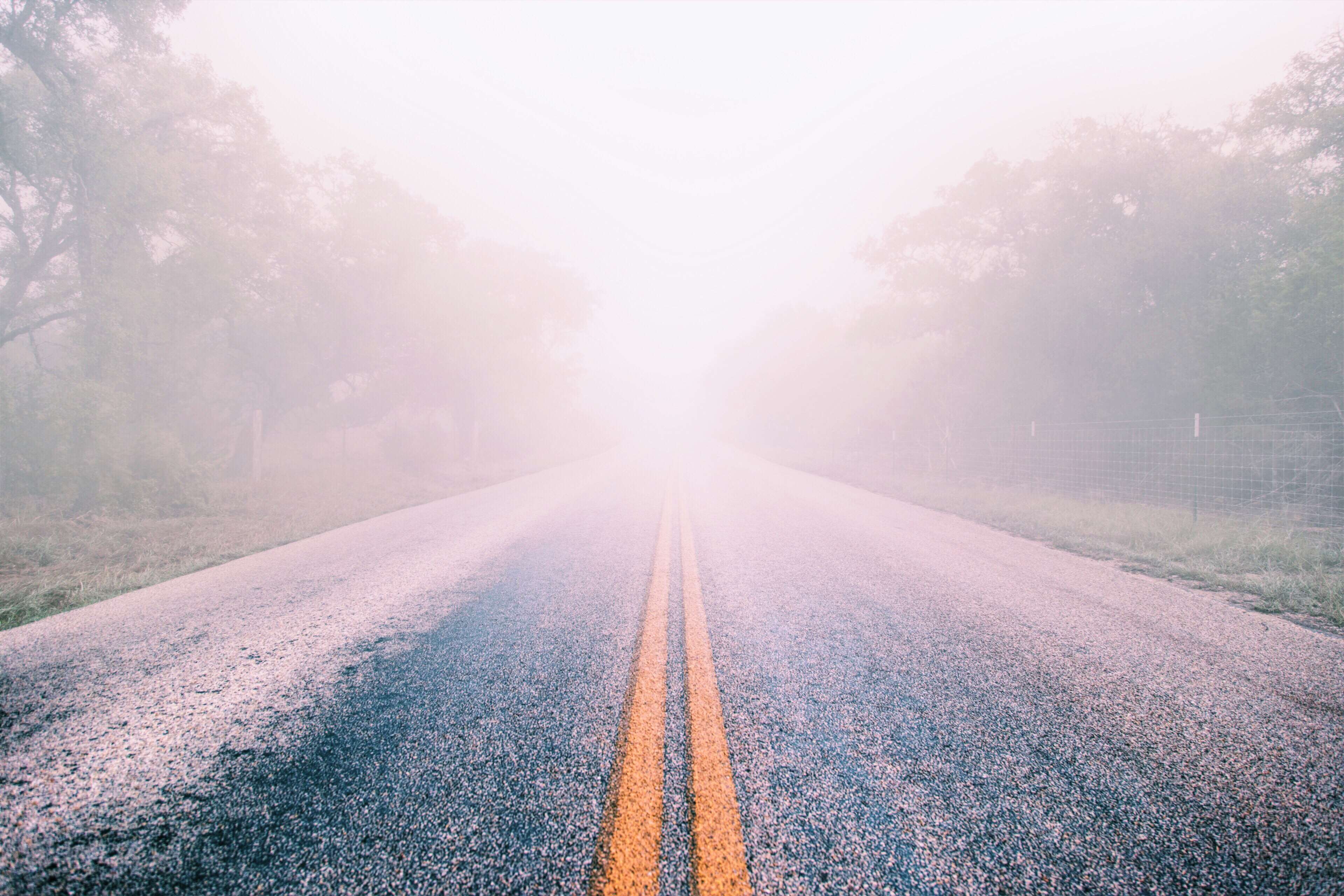 Foggy Road with Double Yellow Lines 4K HD Wallpaper