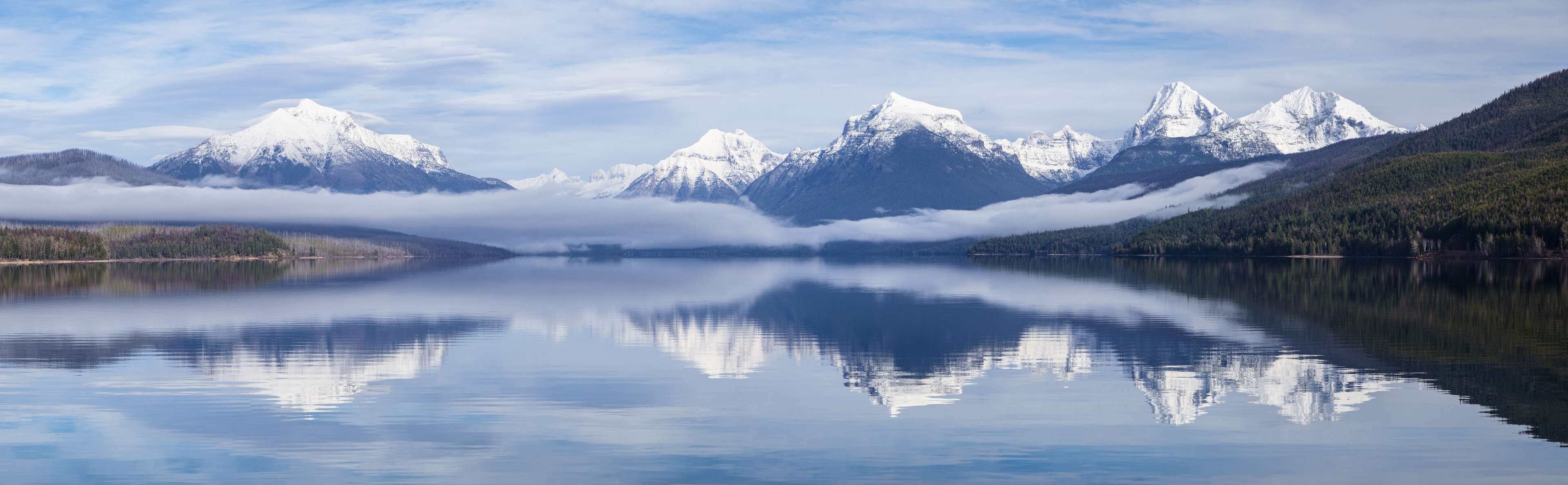 Snow-capped mountains reflected in Lake McDonald, Glacier National Park, Montana 4K HD Wallpaper
