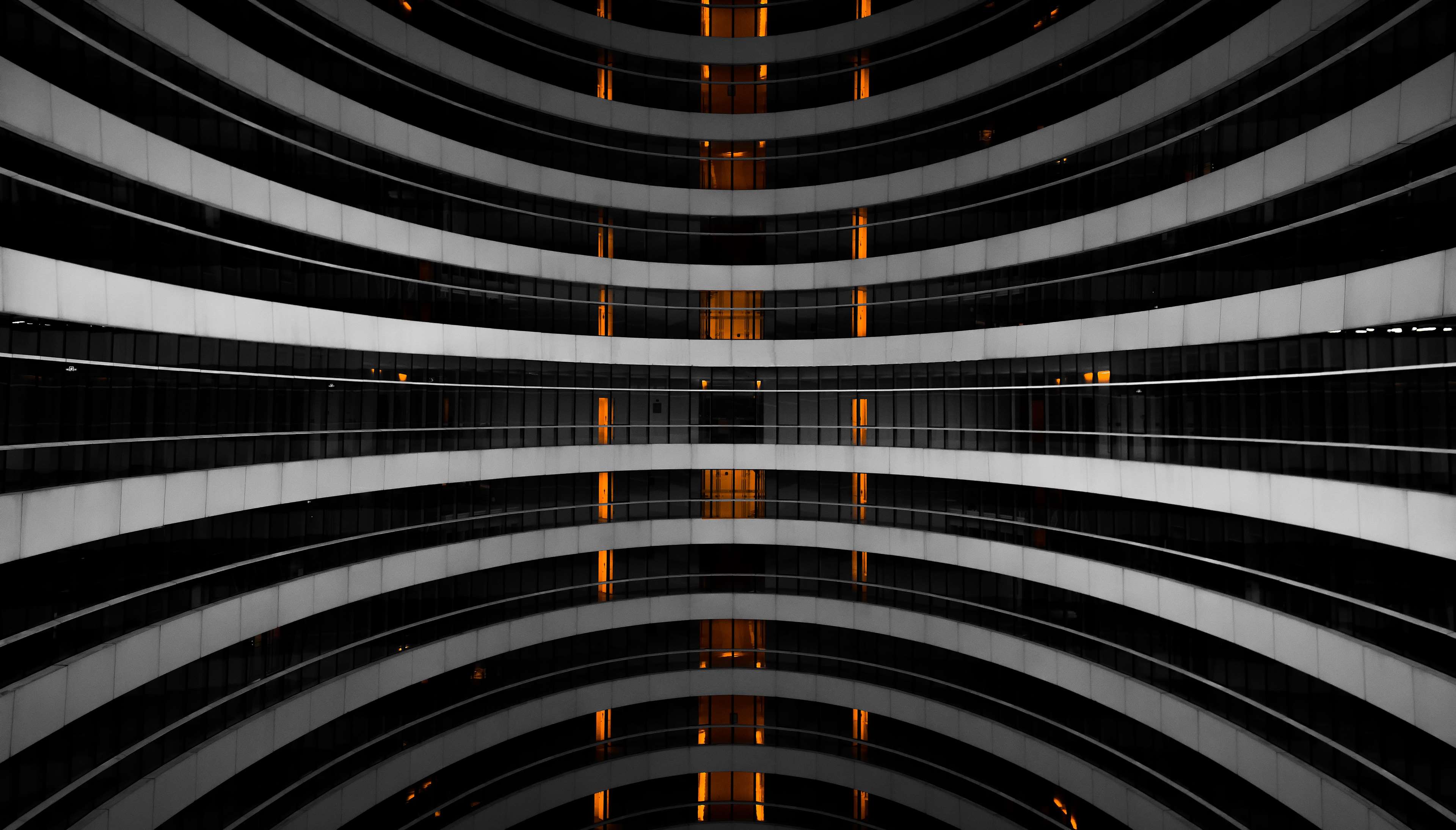 Abstract building with curved floors and orange lights HD Wallpaper