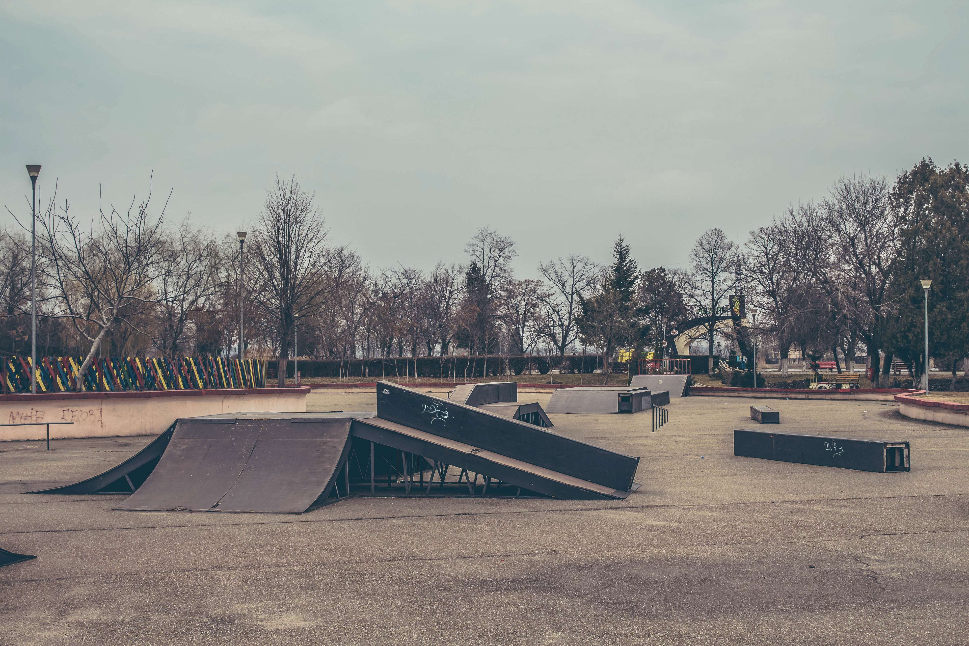Empty Skatepark with Ramps and Trees HD Wallpaper