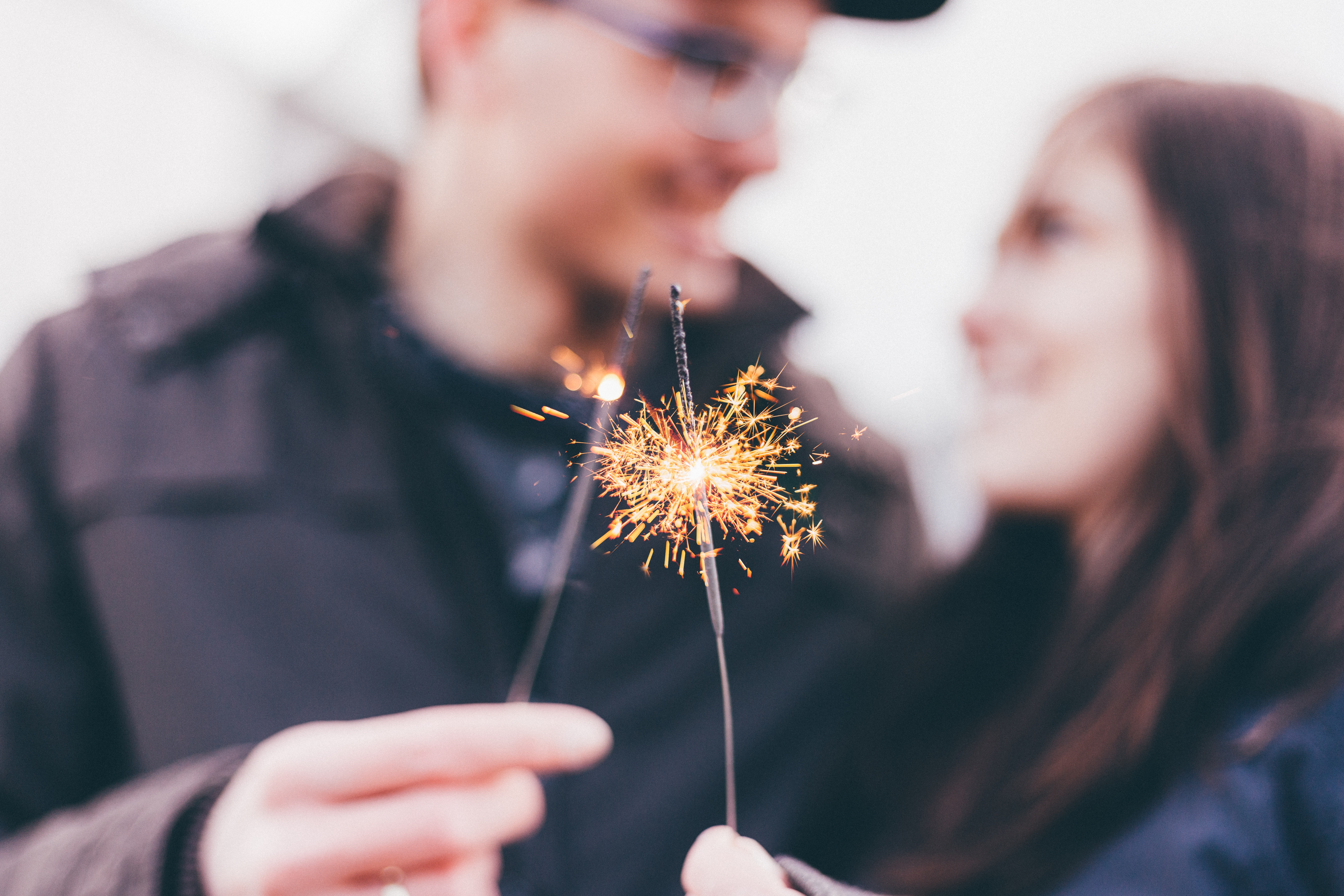 Couple Holding Sparklers HD Wallpaper