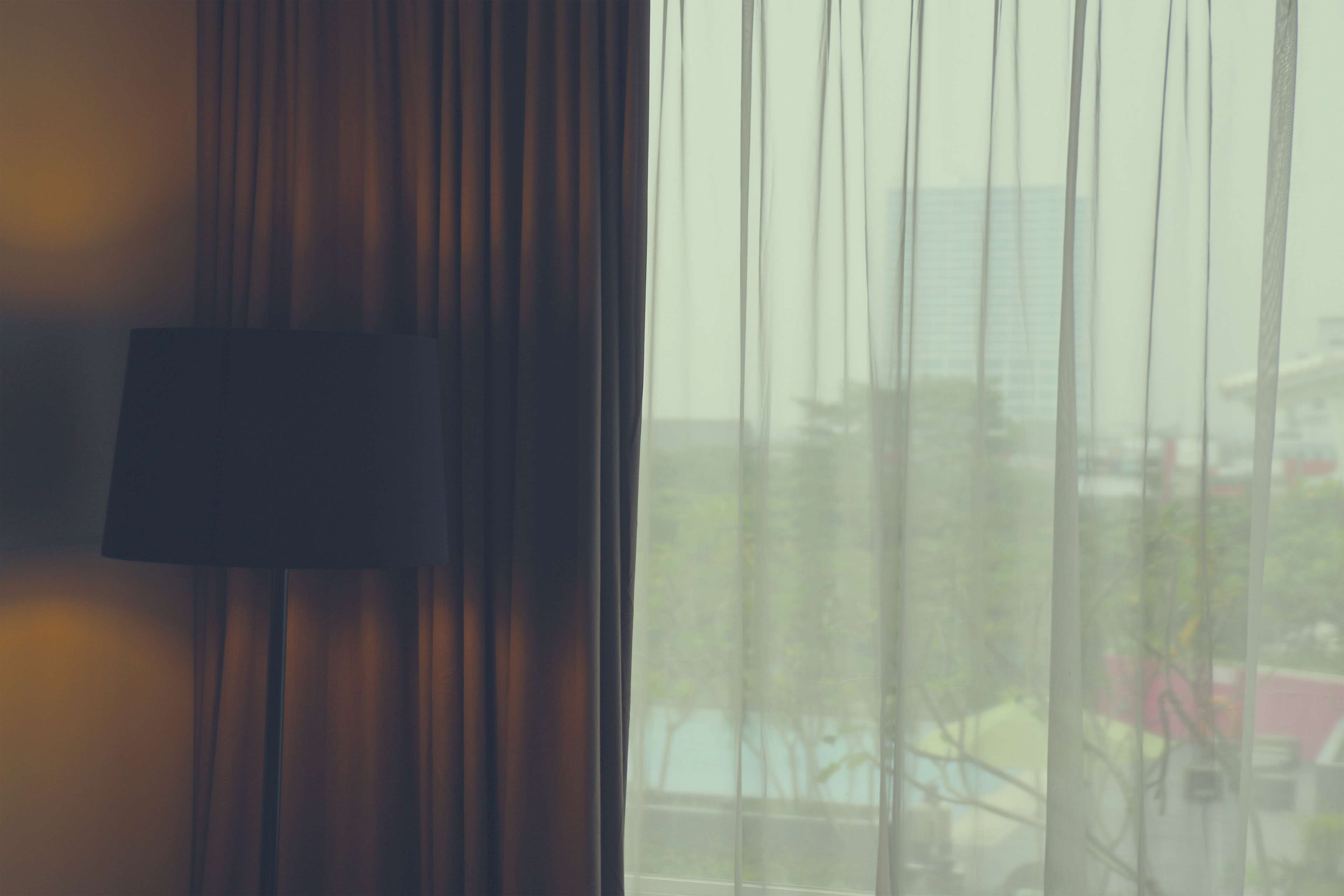 Lamp and curtains in a room with a view HD Wallpaper