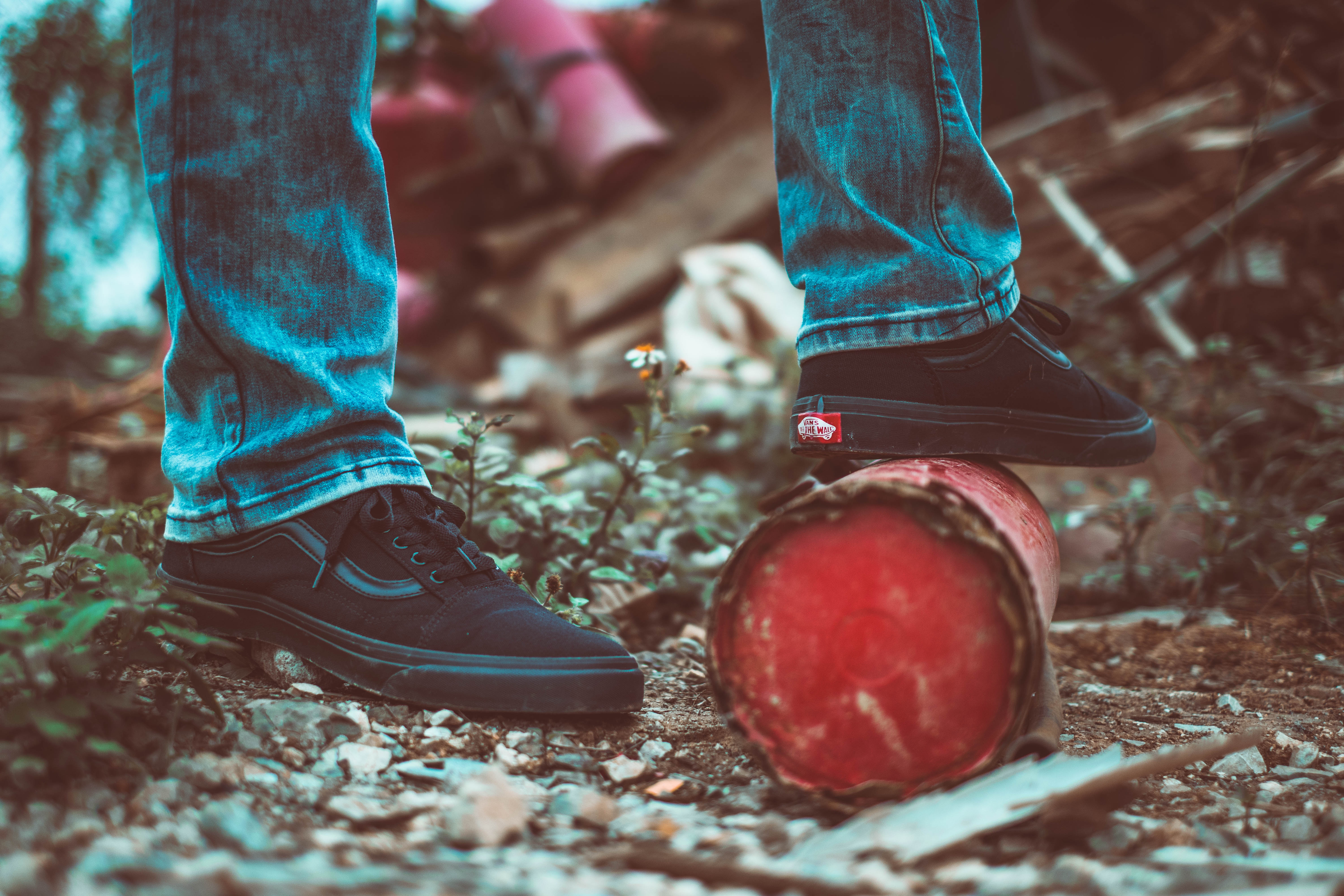 Vans shoes on a red pipe in urban junk HD Wallpaper