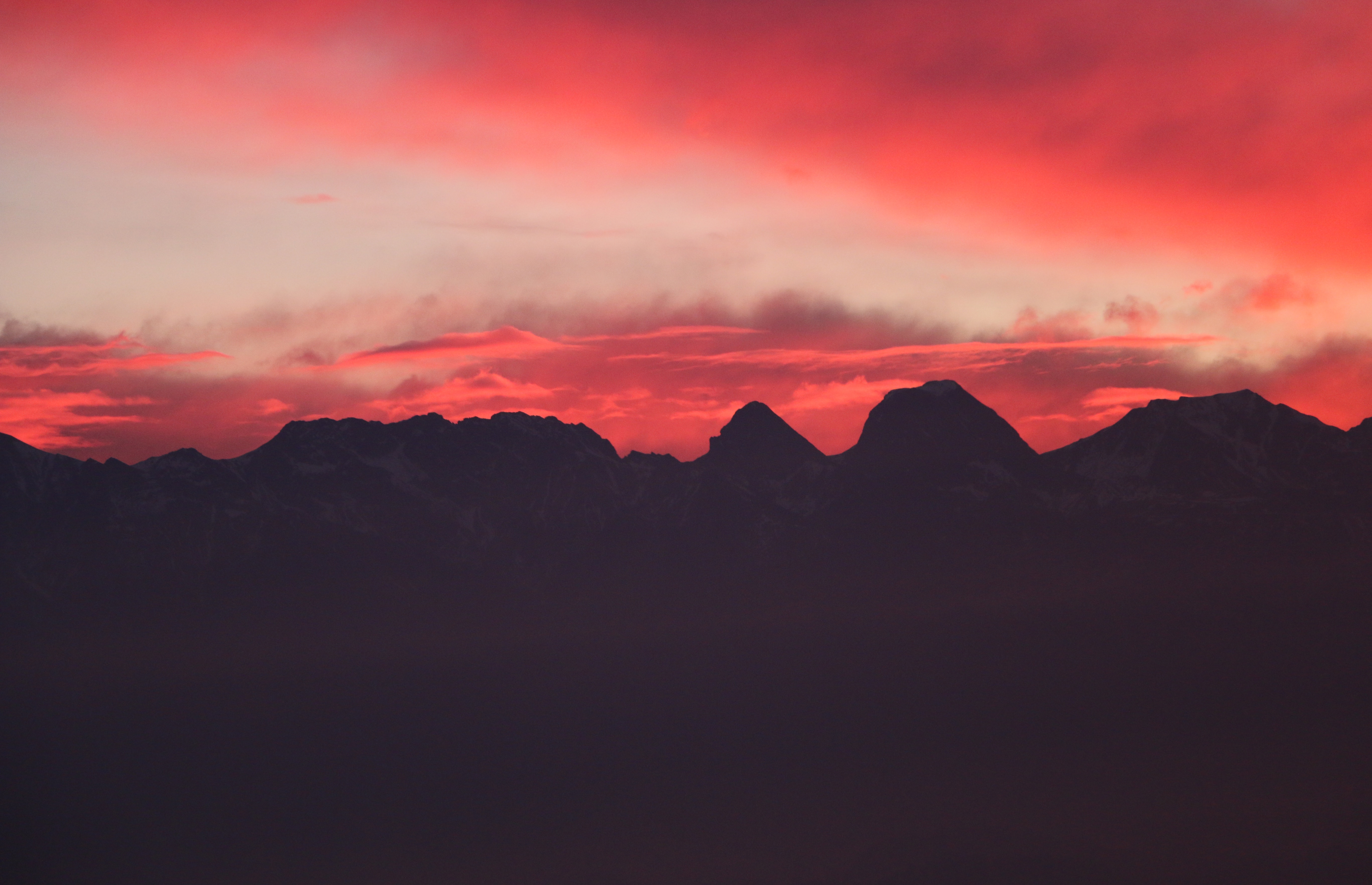 Stockhornkette mountains at sunset with red sky HD Wallpaper