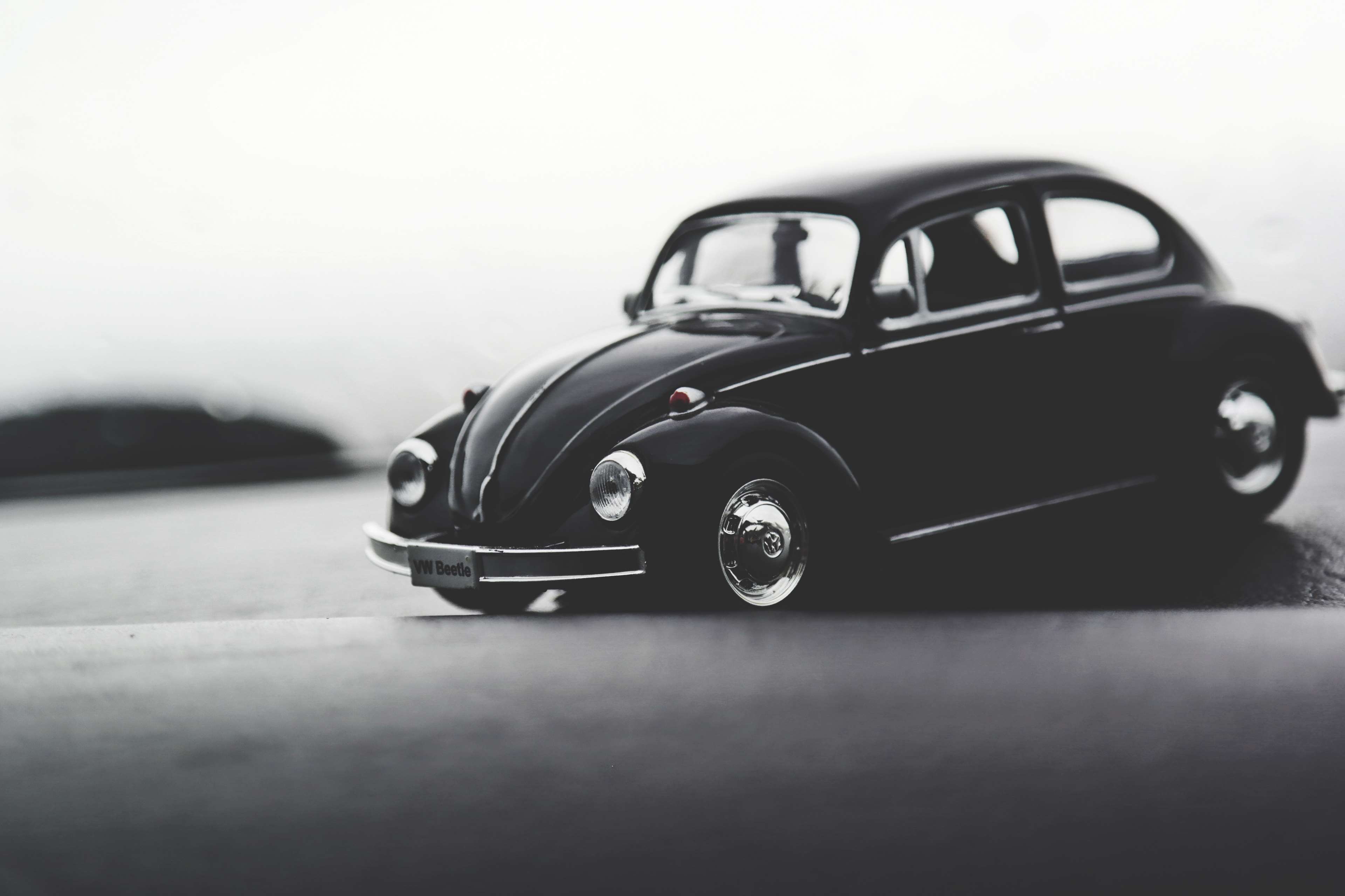 Black Volkswagen Beetle toy car HD Wallpaper