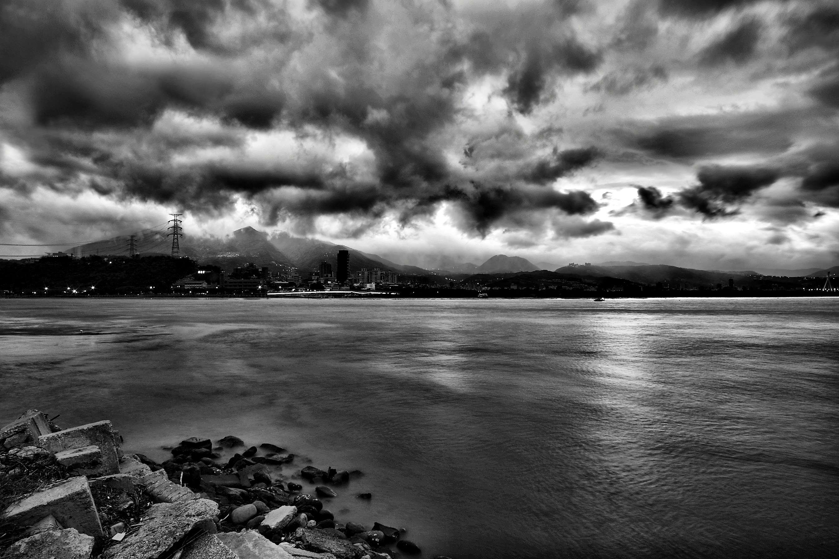 Stormy Sky Over a City and Ocean HD Wallpaper