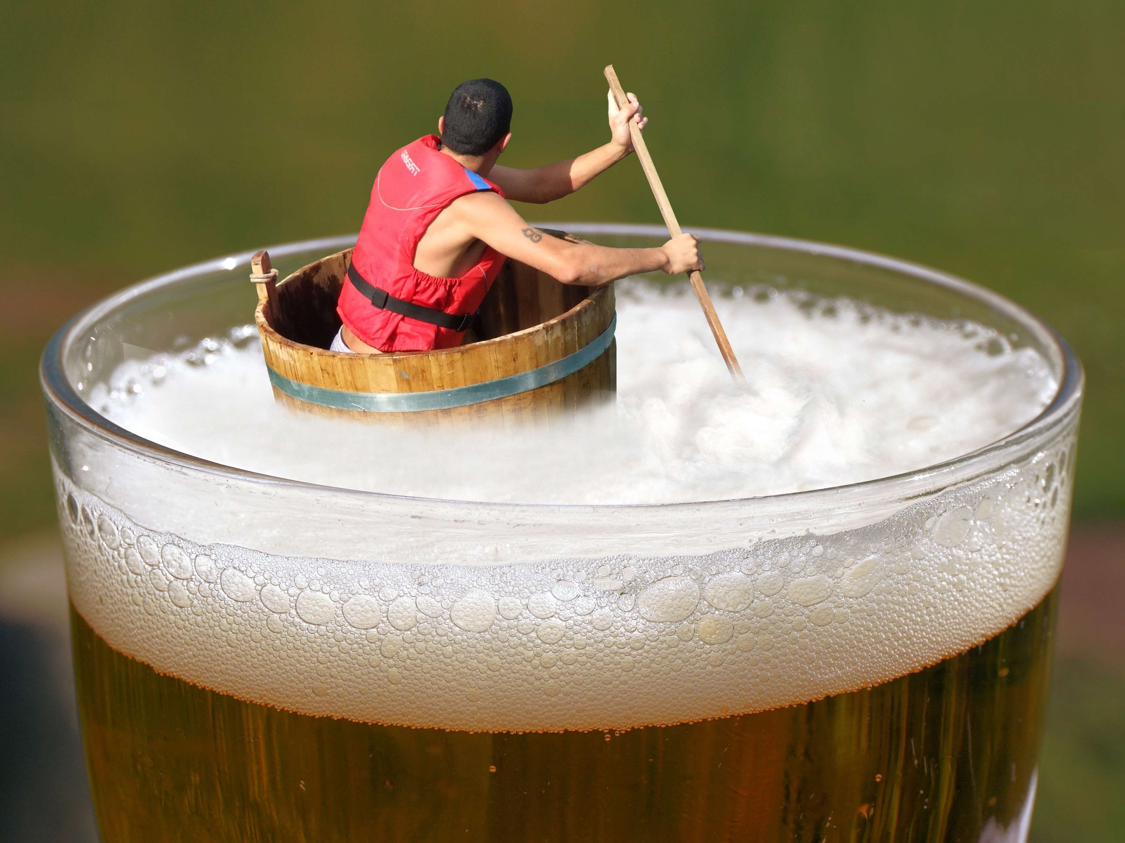 Man in life jacket rowing a barrel boat in a glass of beer HD Wallpaper