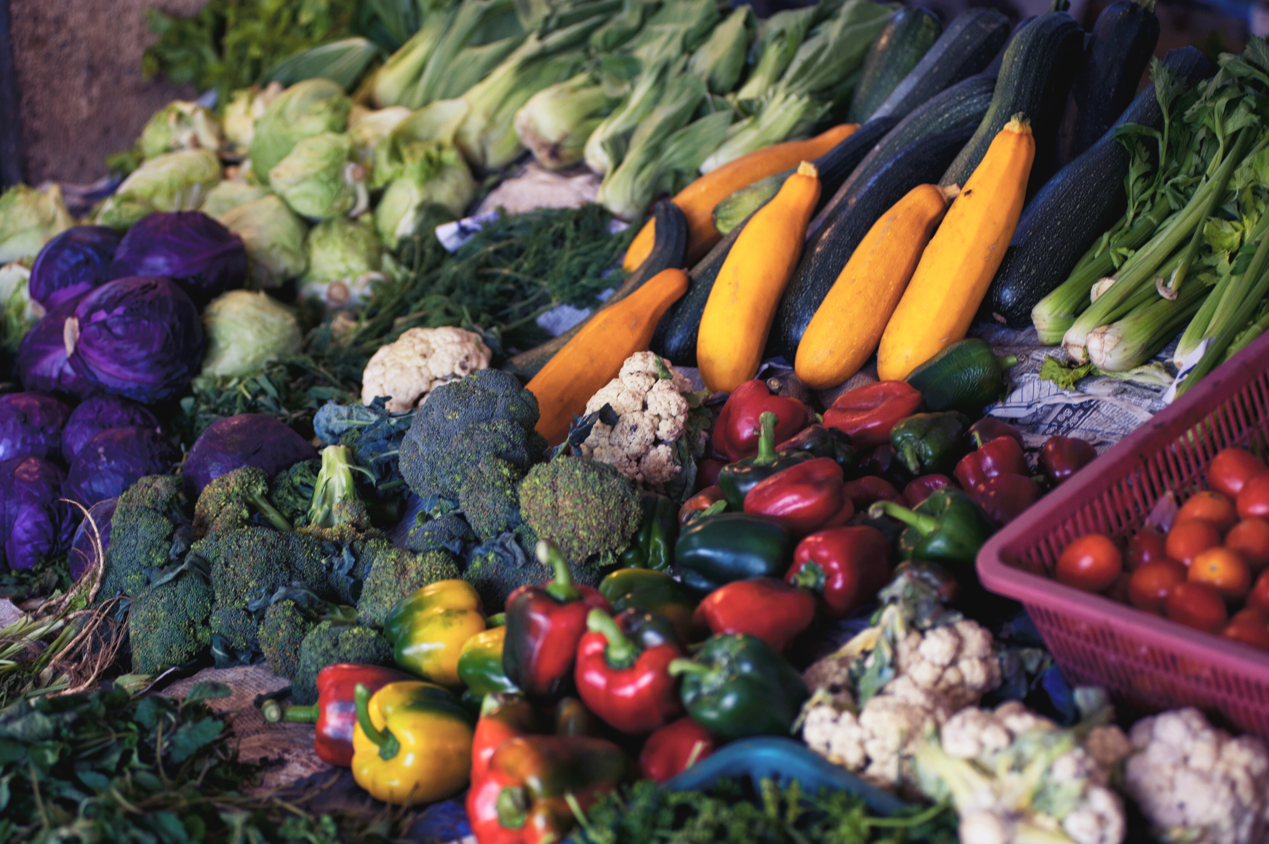 Assortment of fresh vegetables at a market stall HD Wallpaper