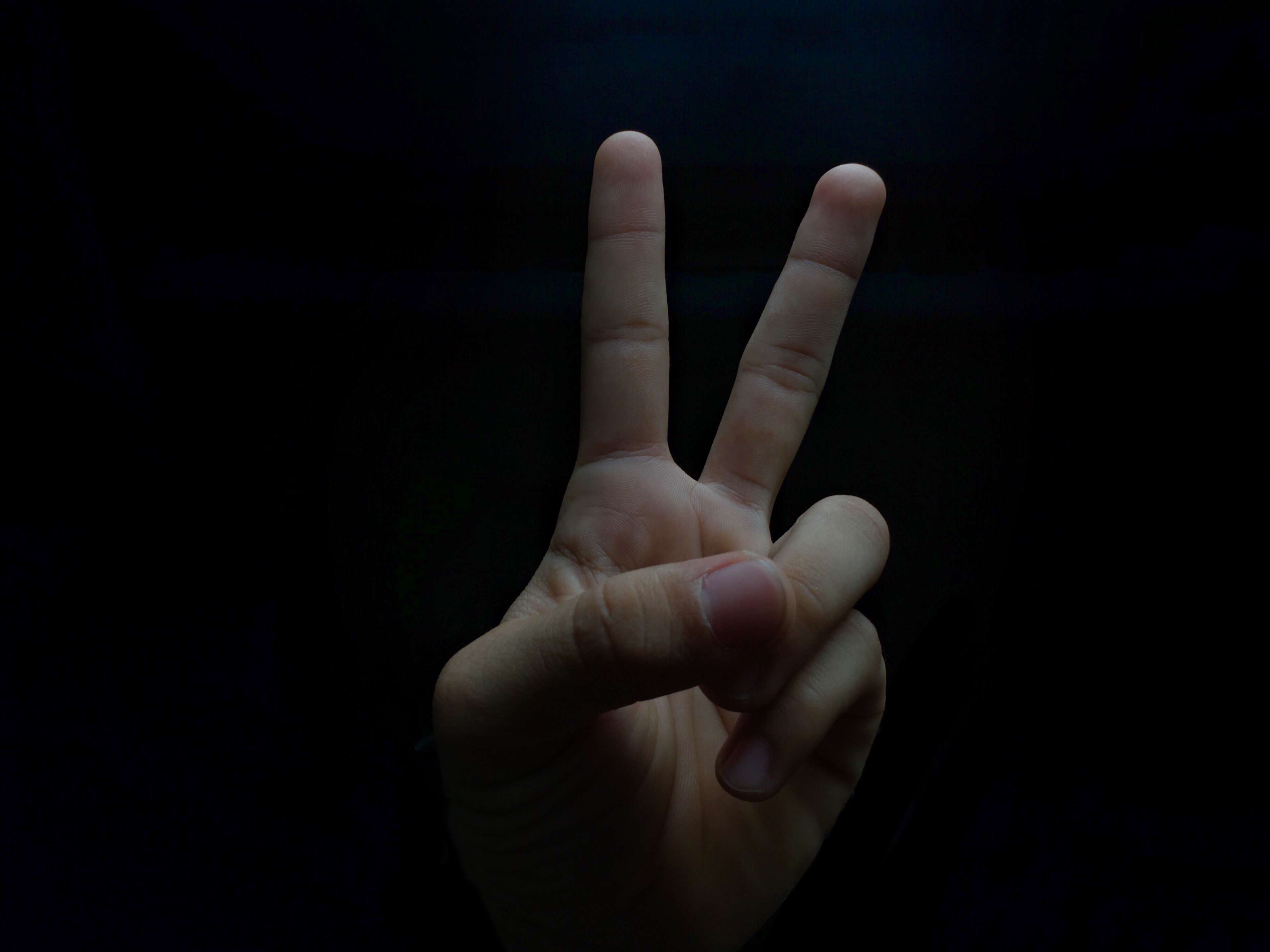 Hand showing peace sign 4K HD Wallpaper