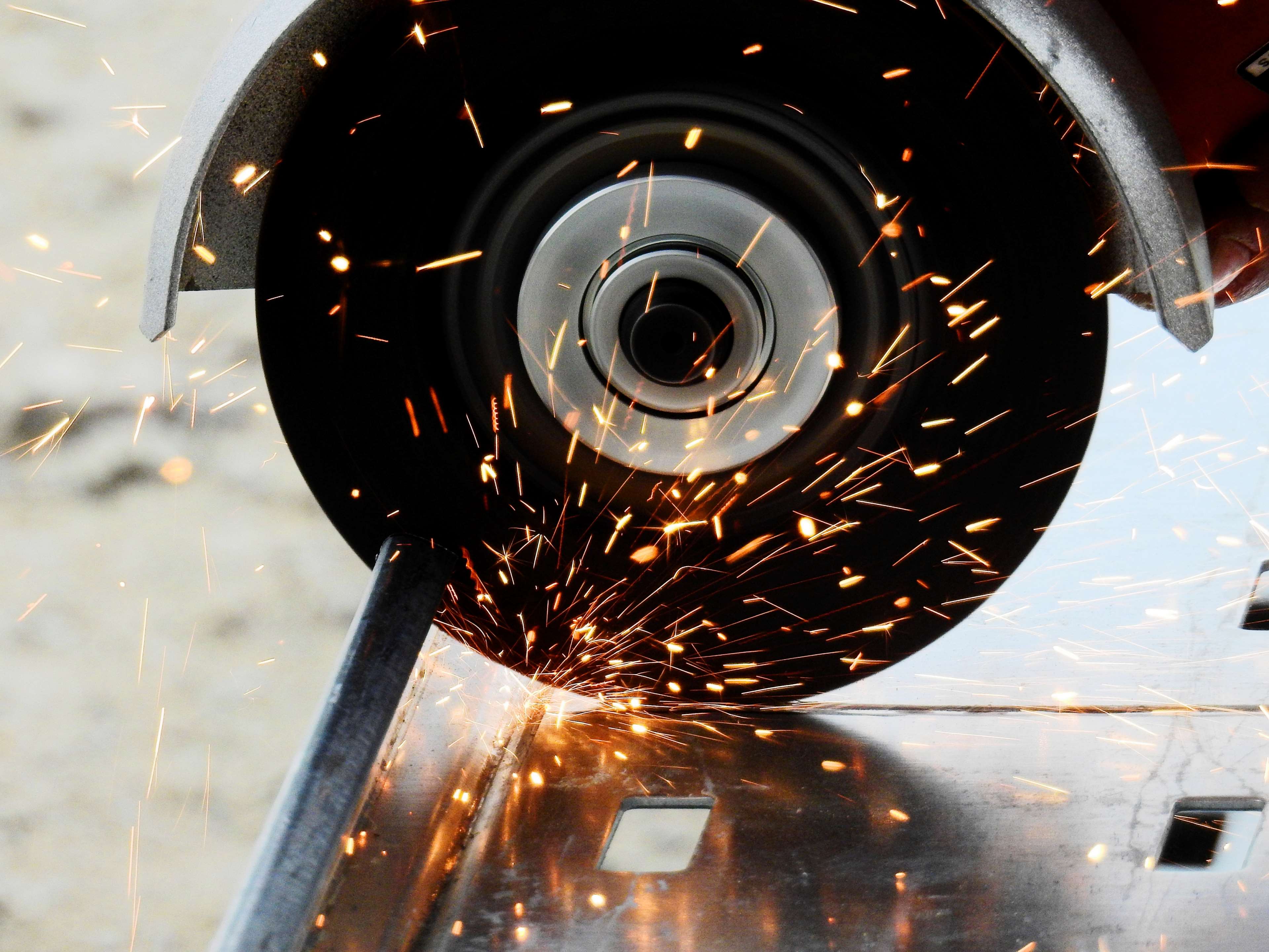 Angle grinder cutting metal with sparks HD Wallpaper