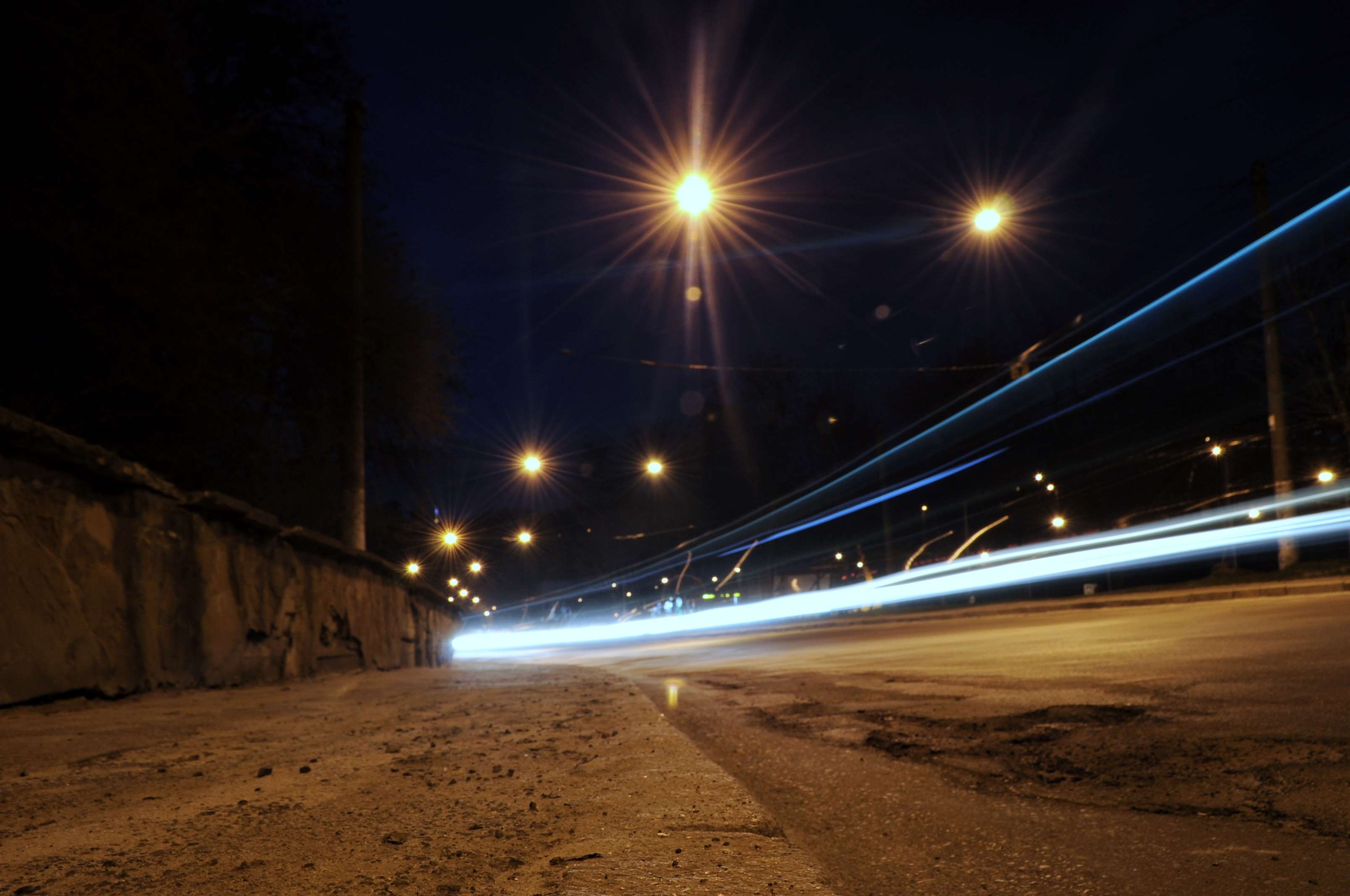 Night road with car light trails and streetlights HD Wallpaper