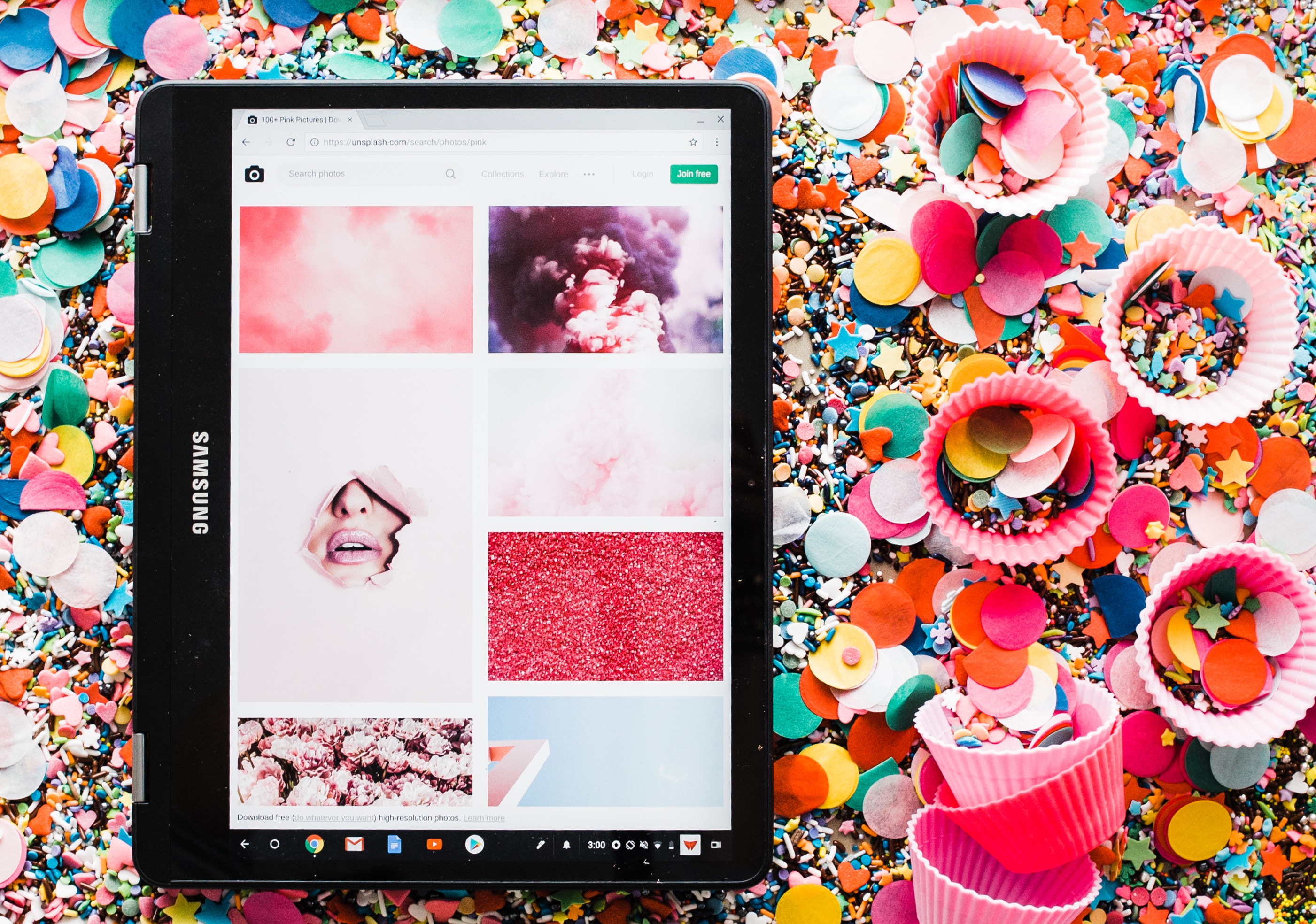 Samsung tablet on colorful confetti and cupcake liners HD Wallpaper