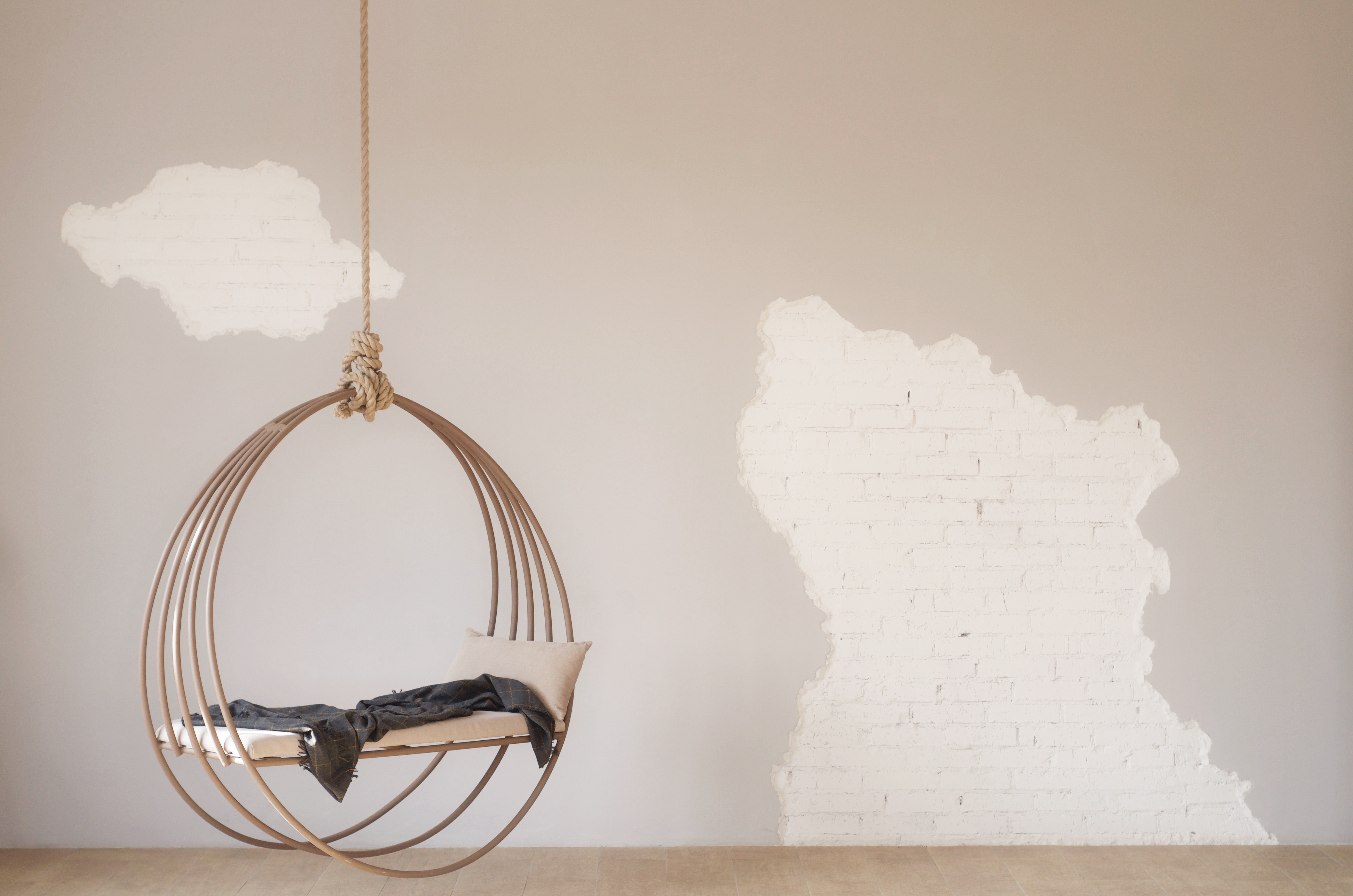 Hanging circular chair with pillow and blanket HD Wallpaper