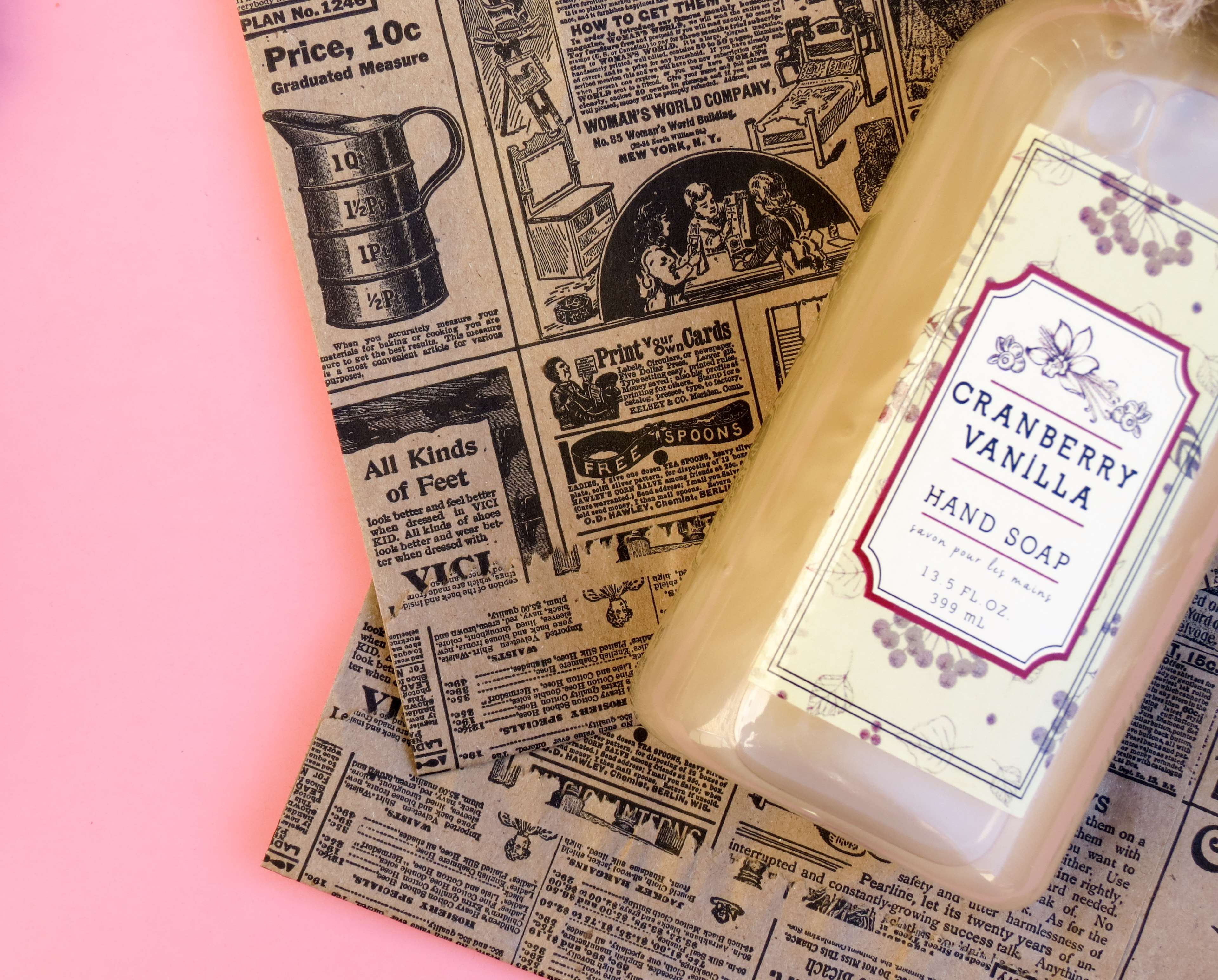 Cranberry Vanilla Hand Soap on Vintage Newspaper Background HD Wallpaper