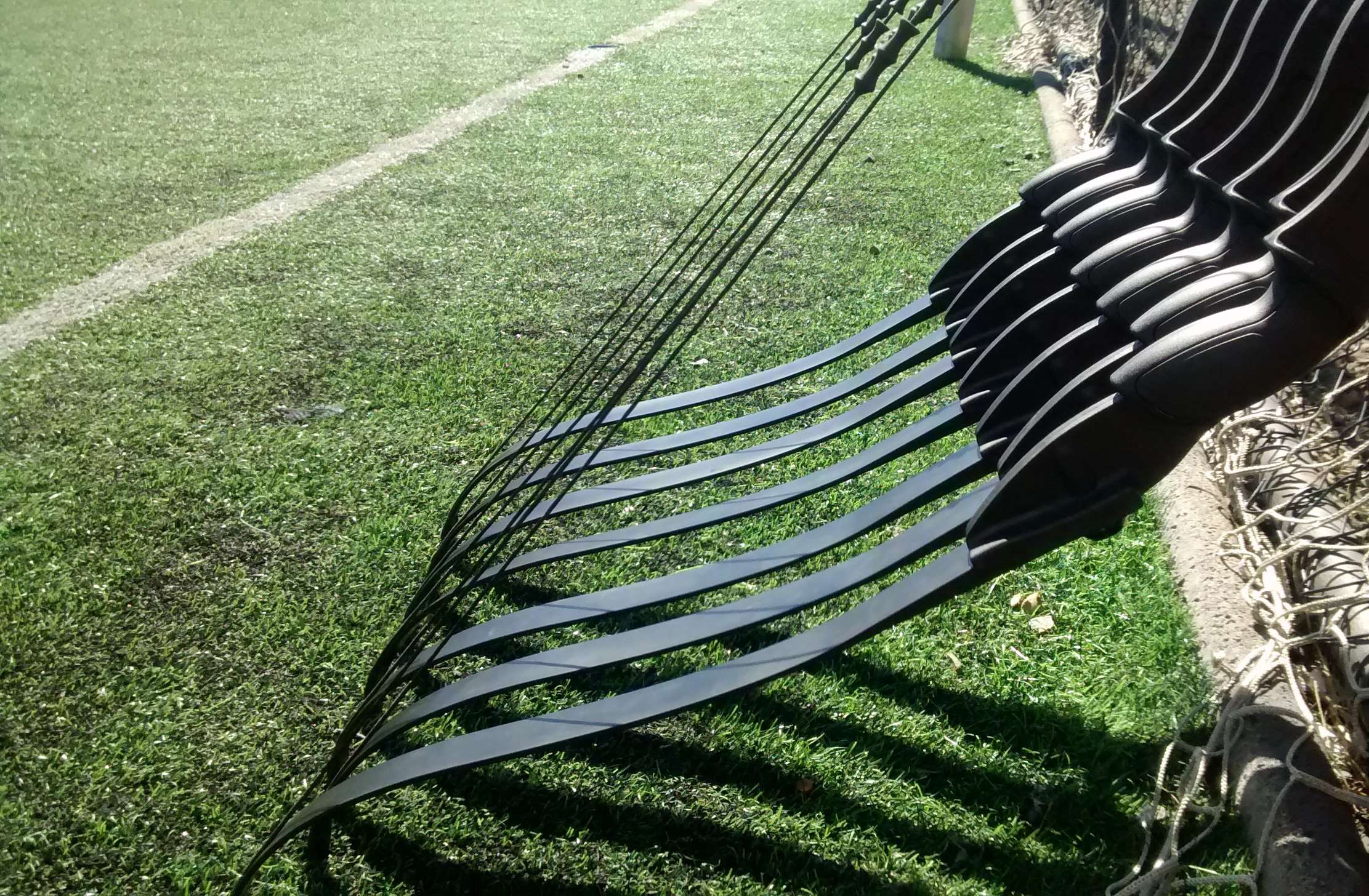 Archery arrows on a grassy field HD Wallpaper