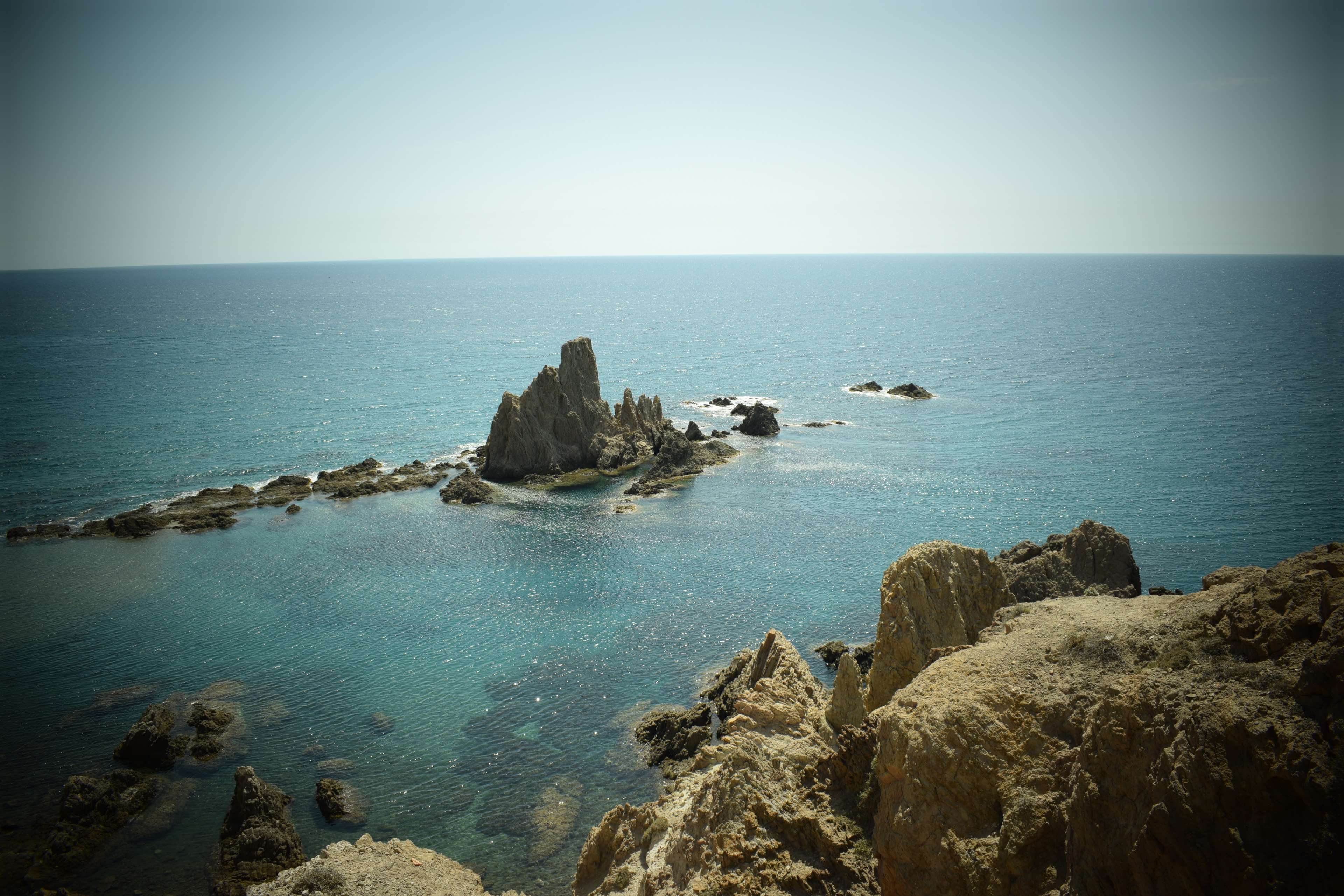 Rocky coast and sea at Cabo de Gata HD Wallpaper