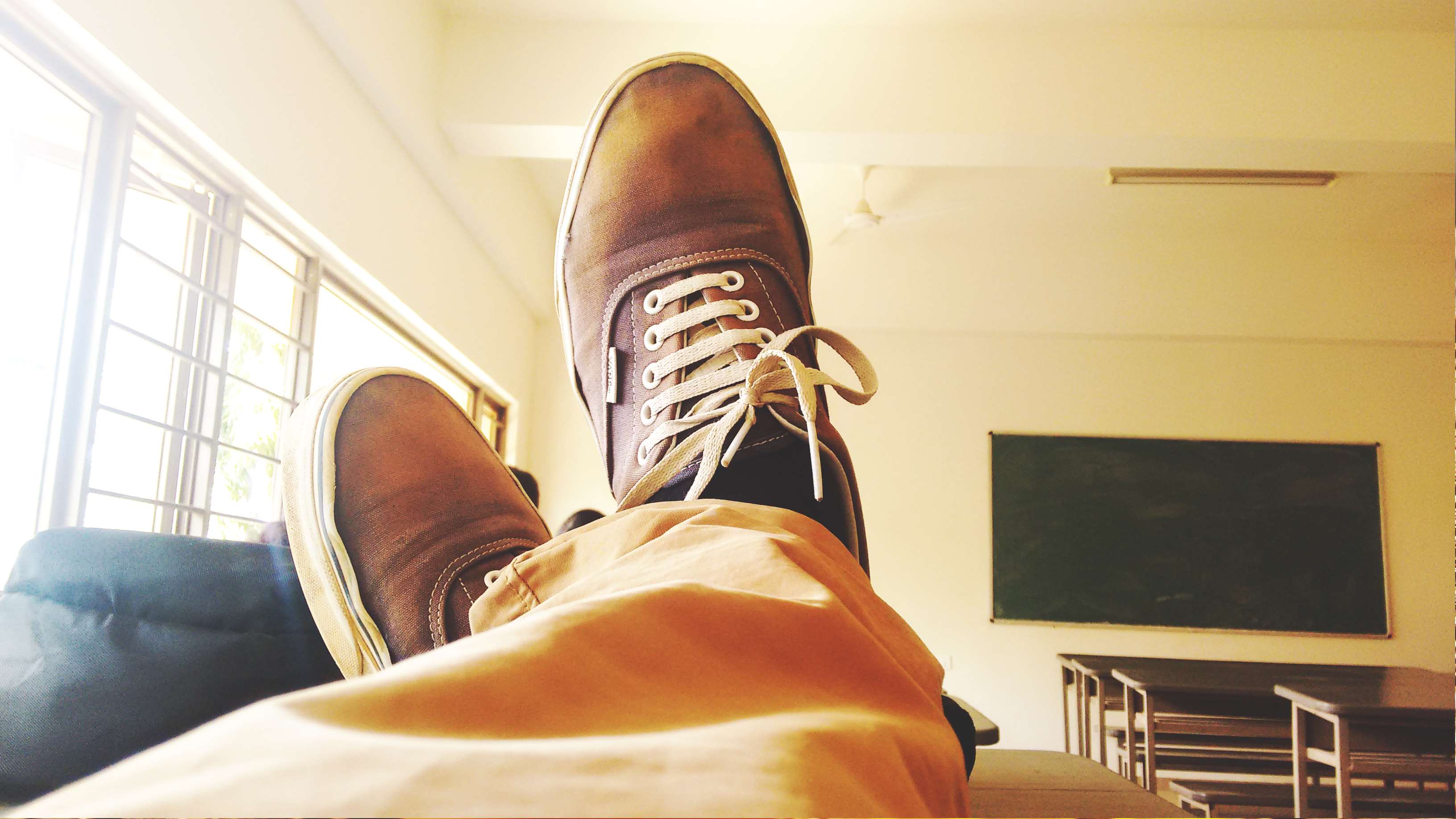 Person wearing Vans shoes in a classroom HD Wallpaper