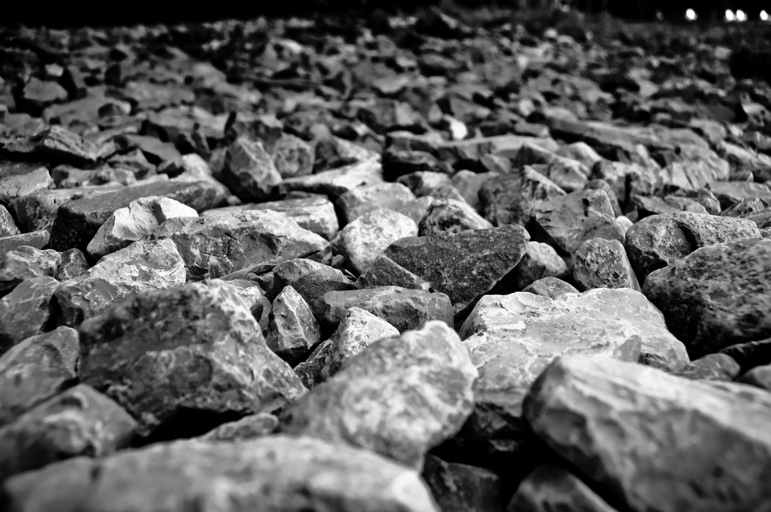 Black and white close-up of gravel and rocks HD Wallpaper