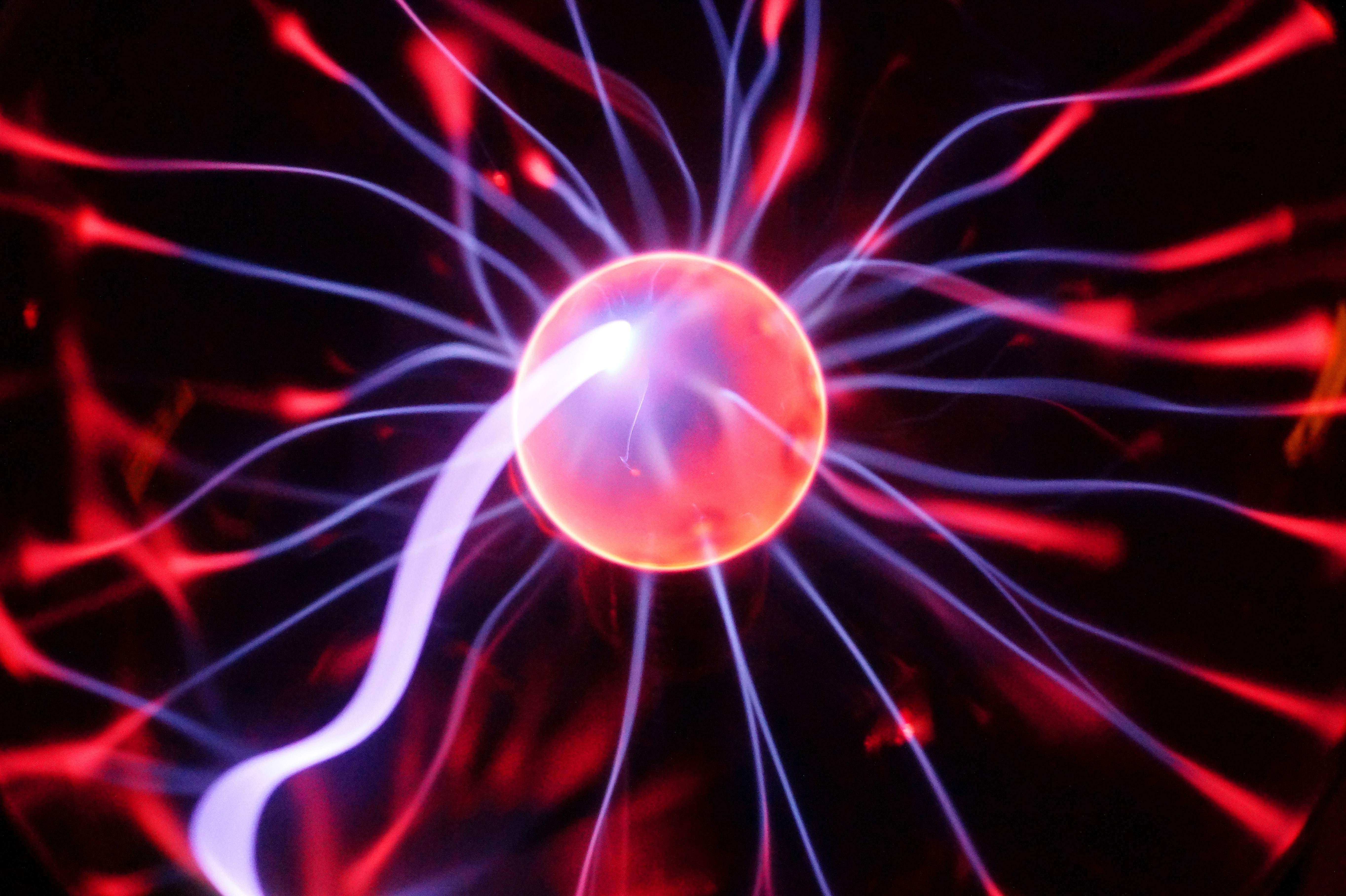 Plasma ball with red and blue light streams HD Wallpaper