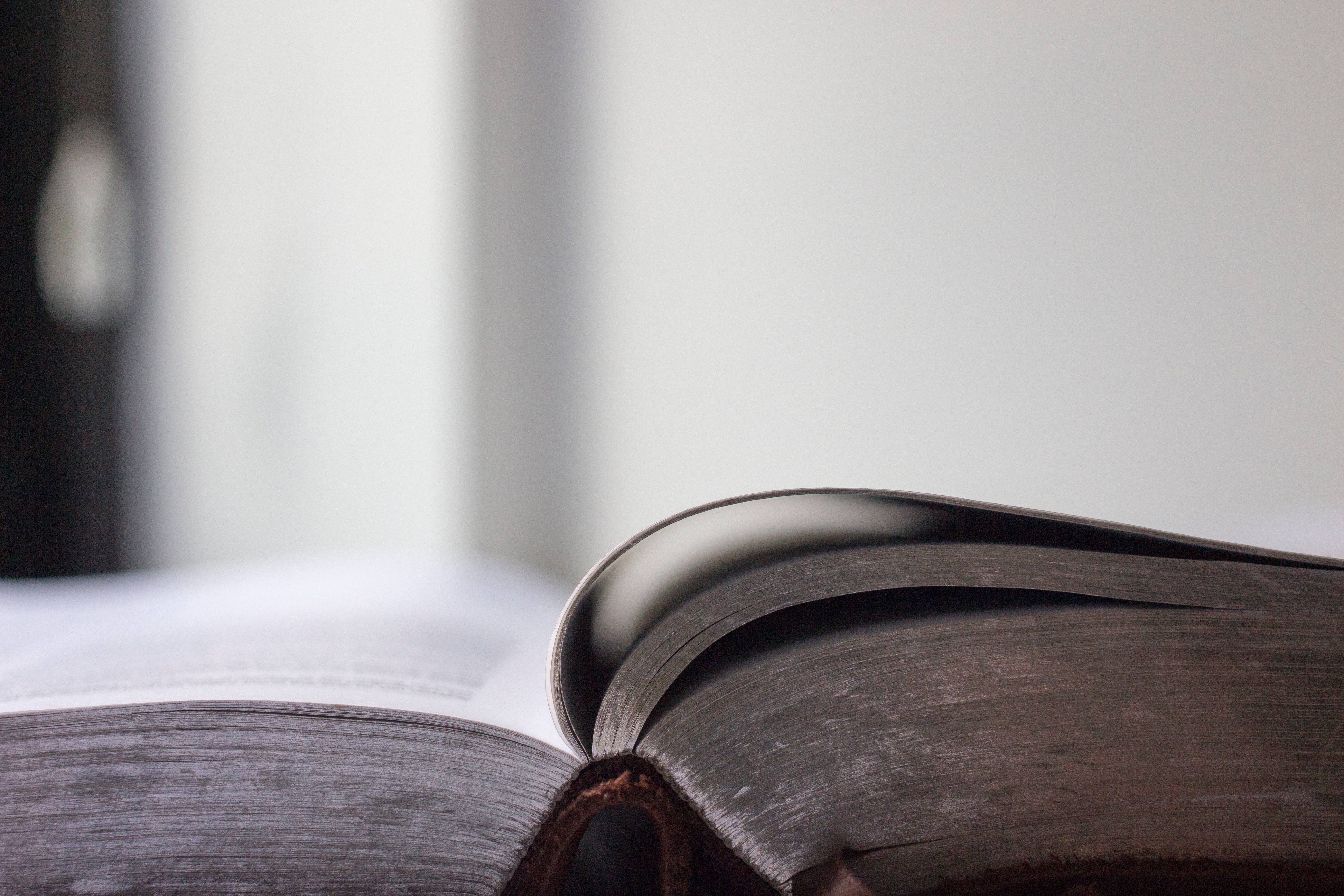 Open old book with dark pages HD Wallpaper