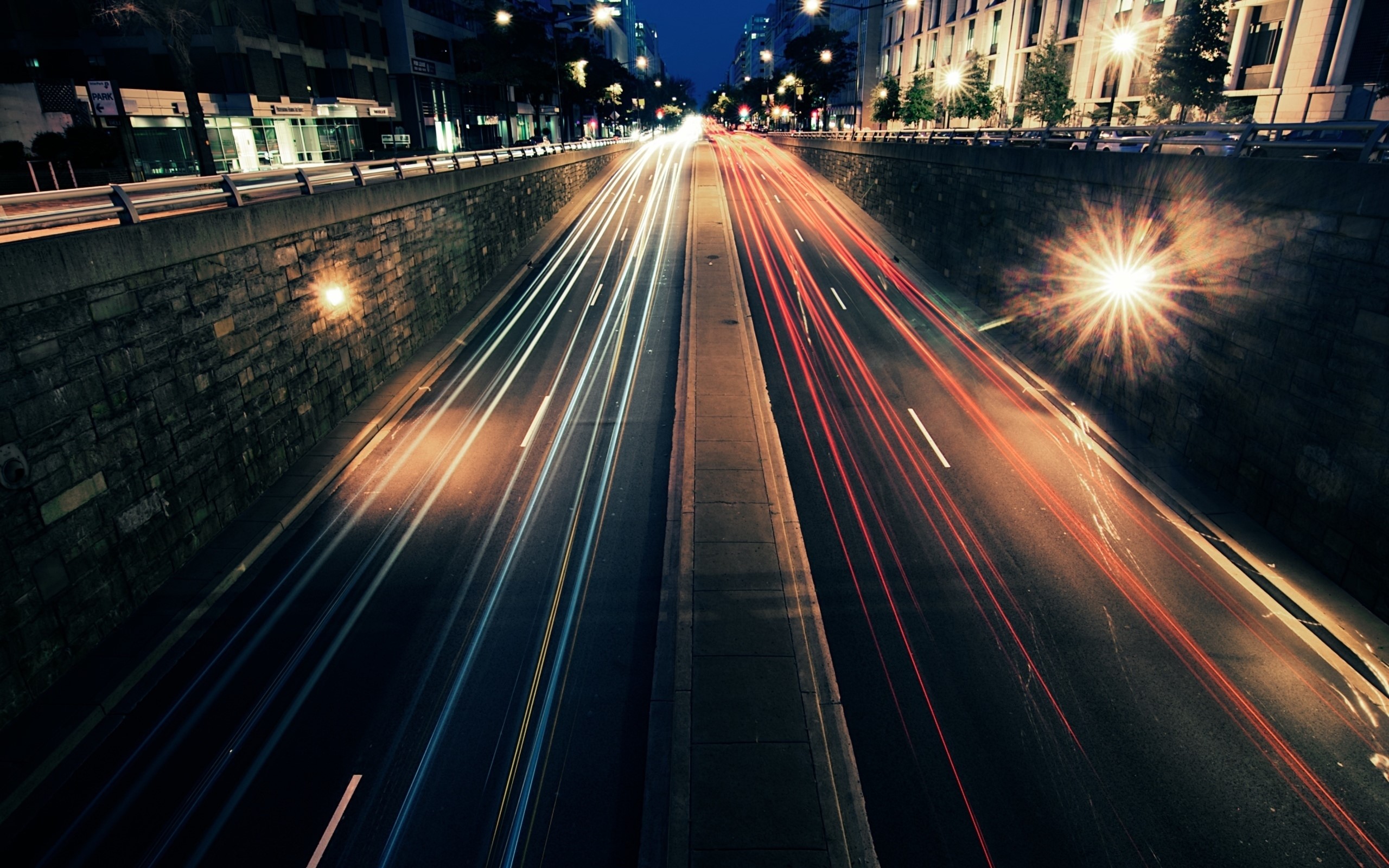 Light trails on a city road at night HD Wallpaper