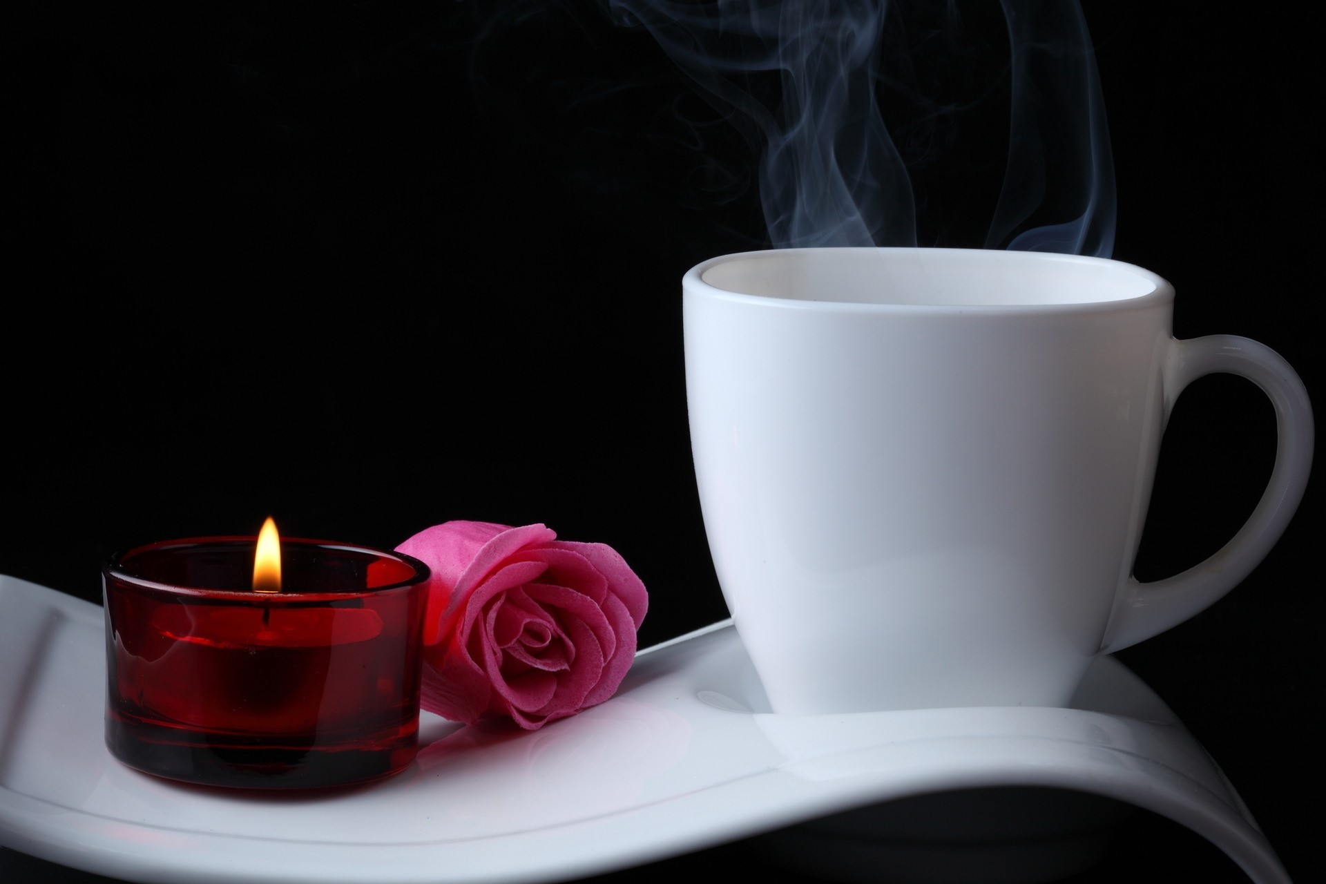 White coffee cup with steam, pink rose, and candle HD Wallpaper