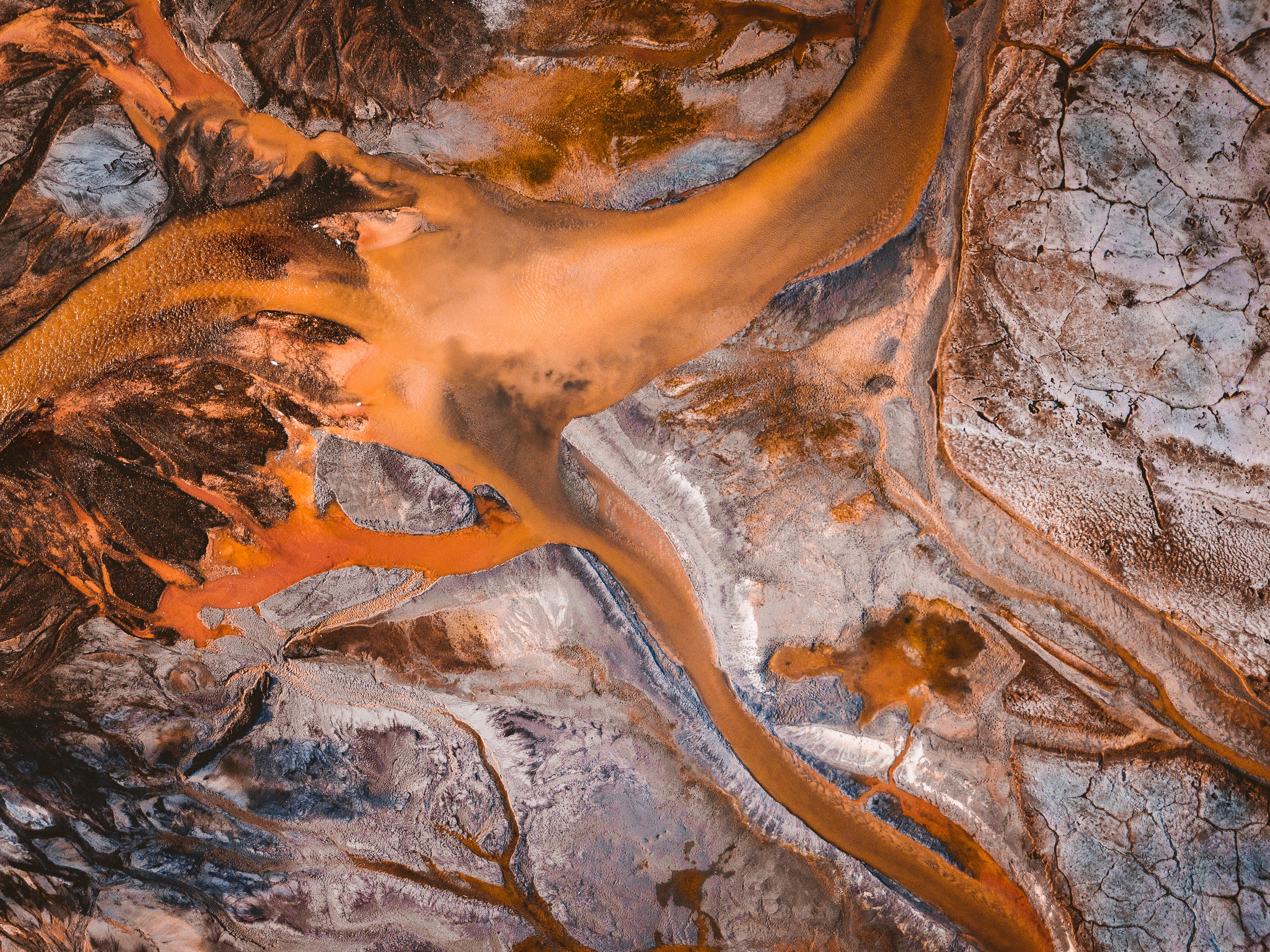 Aerial view of toxic sludge and wastewater river HD Wallpaper