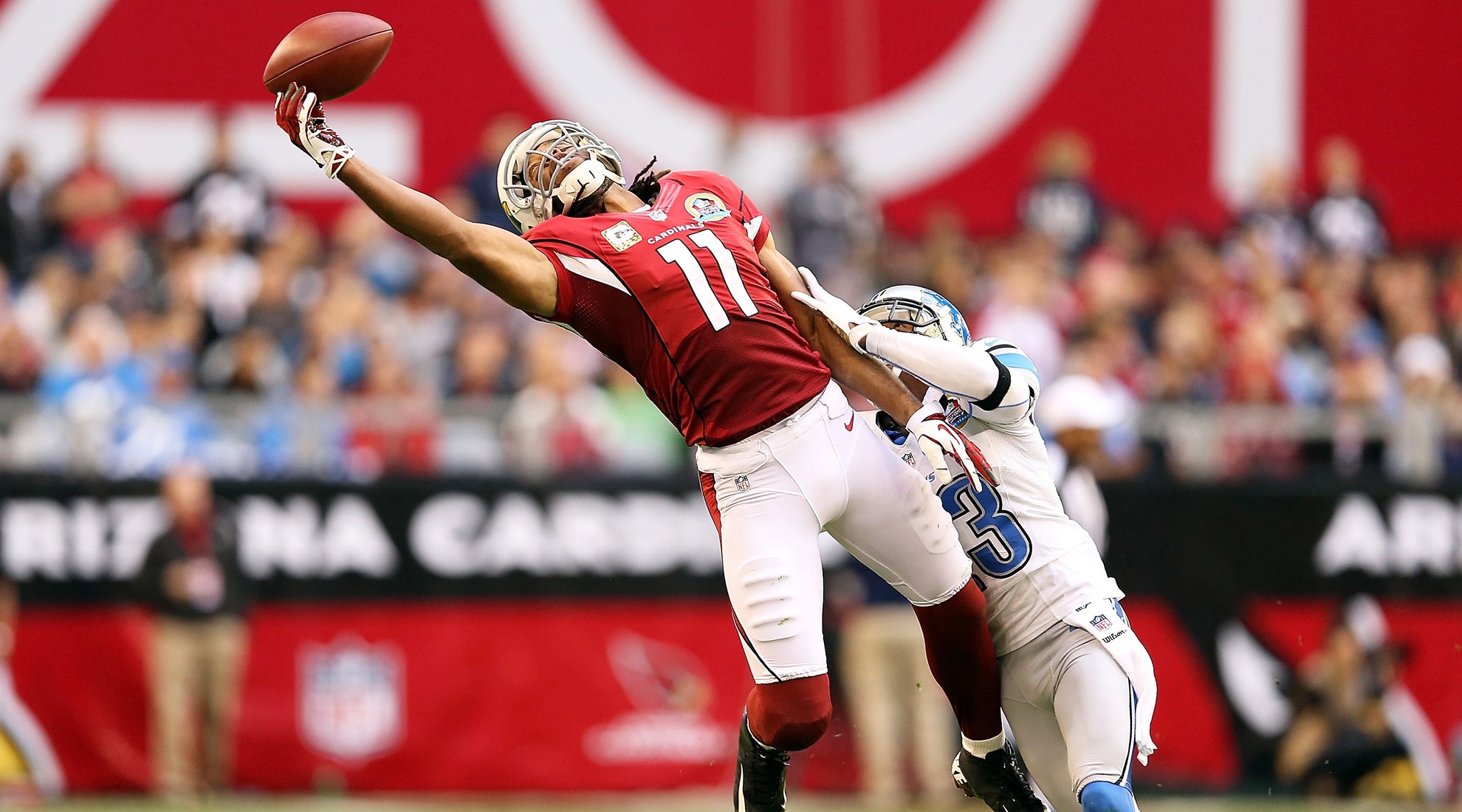 Larry Fitzgerald makes a catch against the Detroit Lions HD Wallpaper