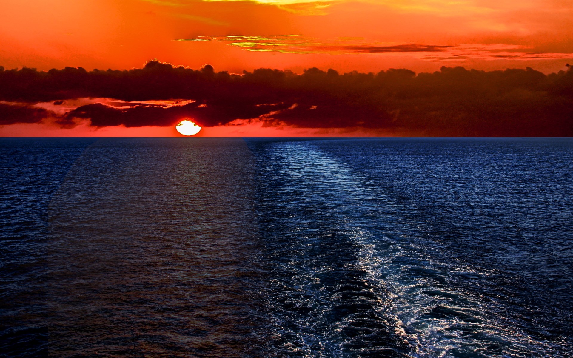 Sunset over the ocean with a wake HD Wallpaper