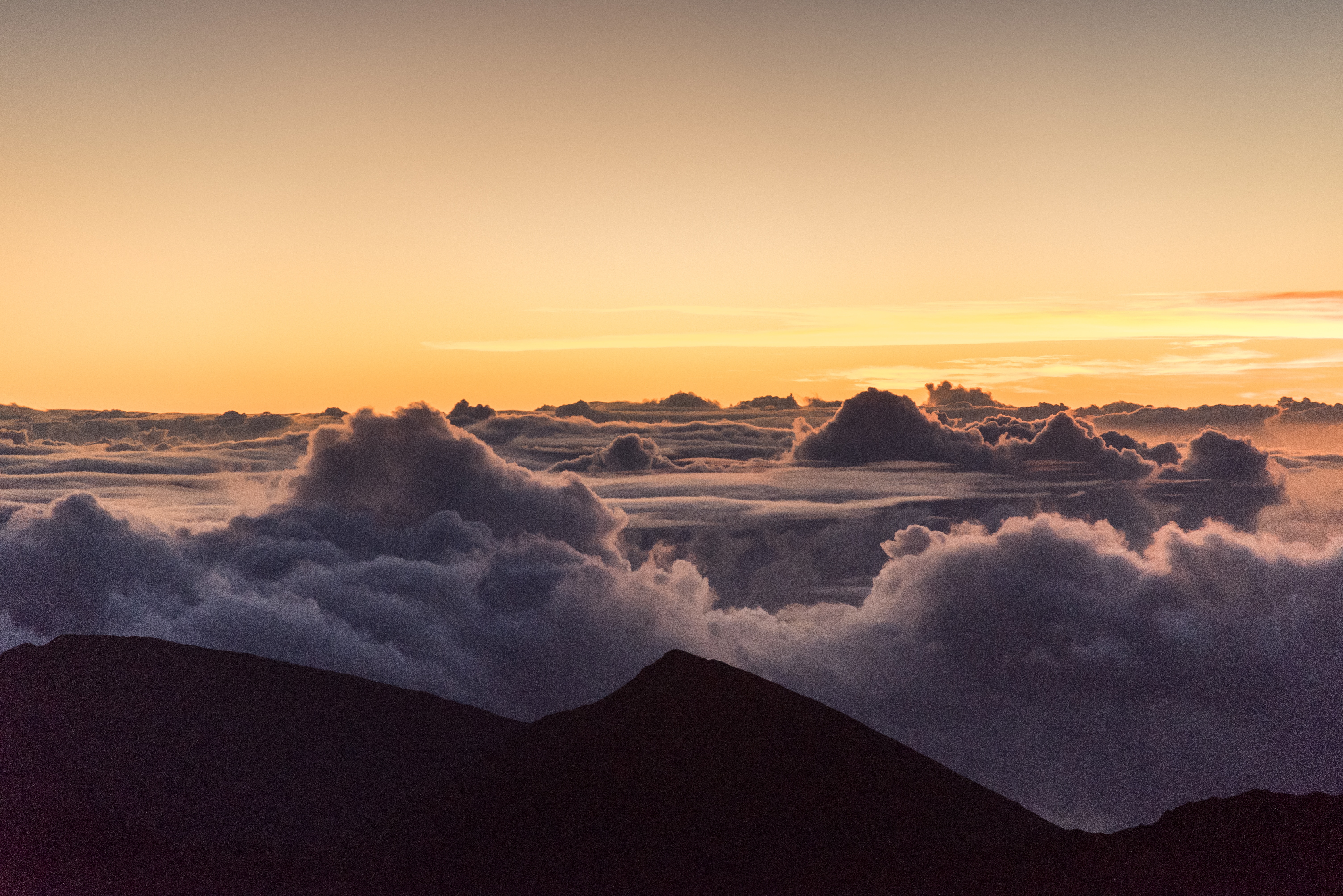 Above the clouds at sunrise HD Wallpaper