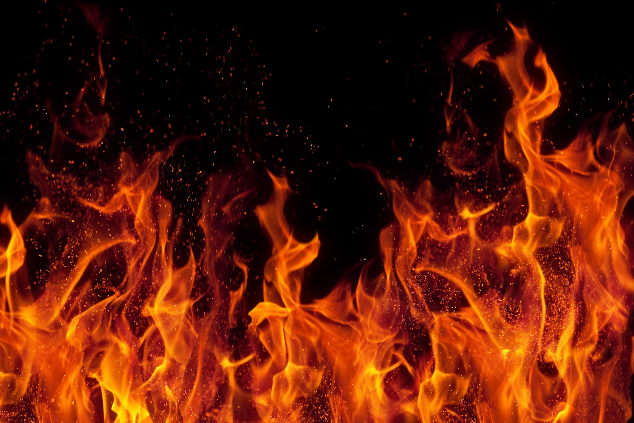 Flames and sparks on a black background HD Wallpaper