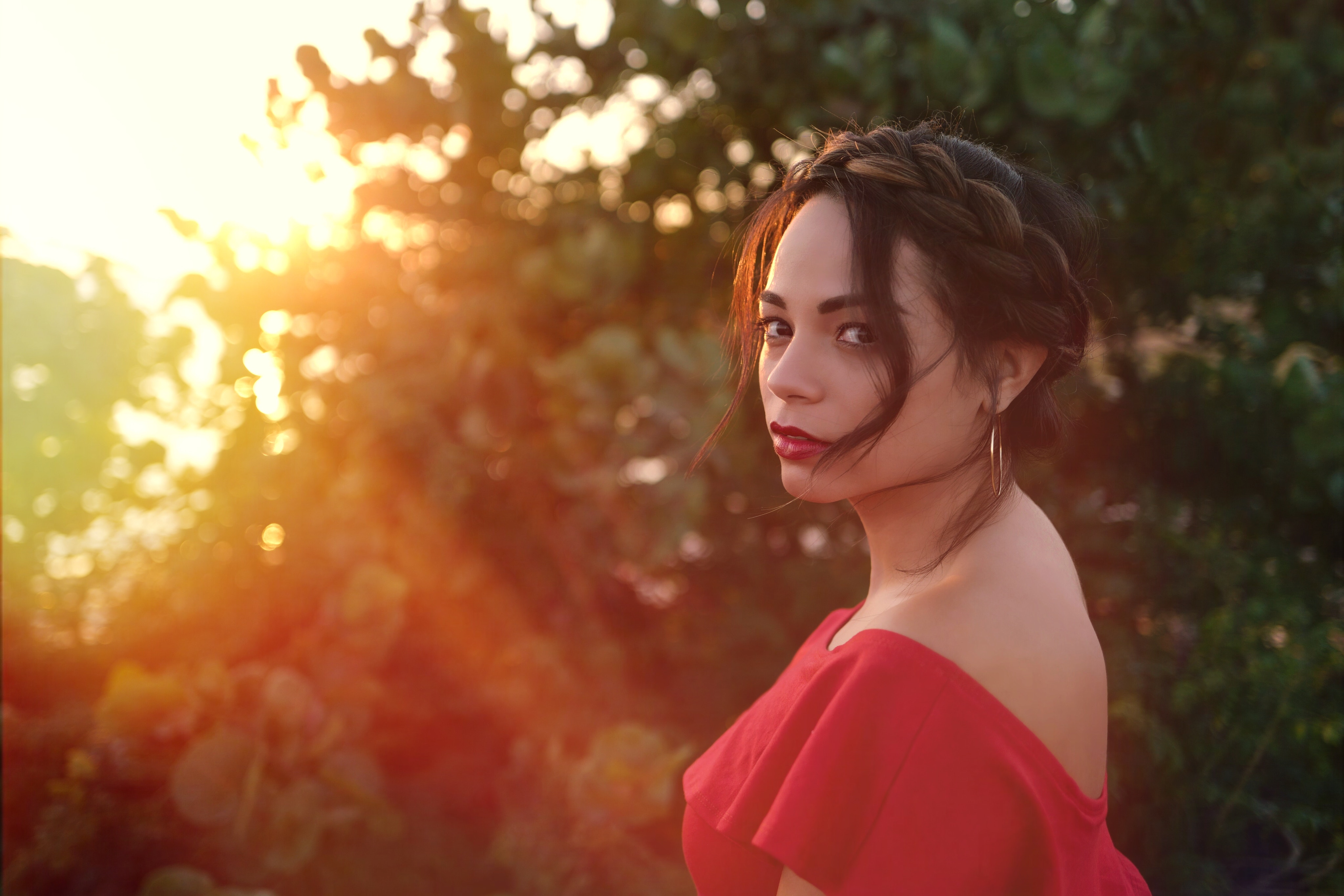 Woman in red dress with braid at sunset HD Wallpaper
