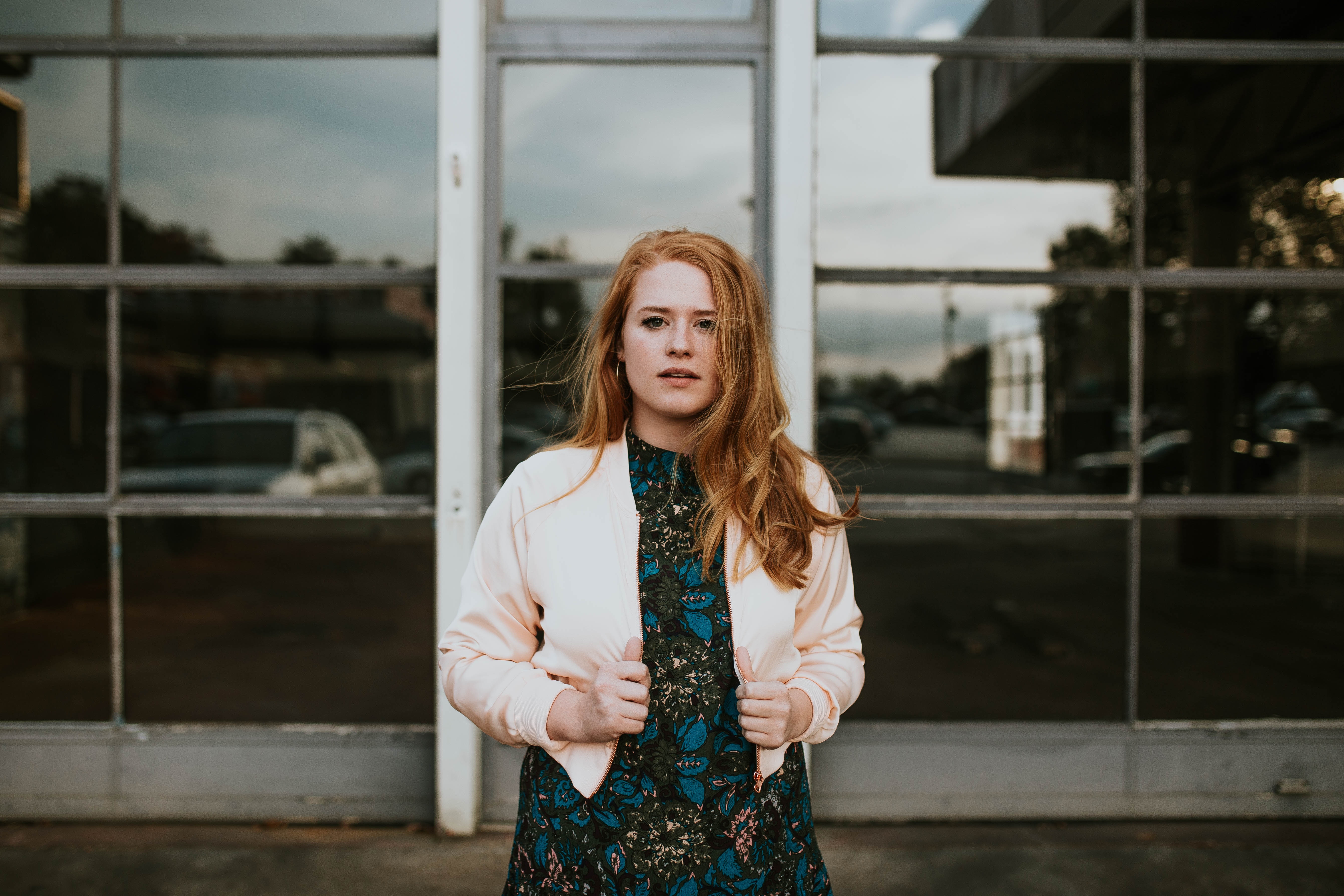 Woman with red hair in a light jacket and dress HD Wallpaper