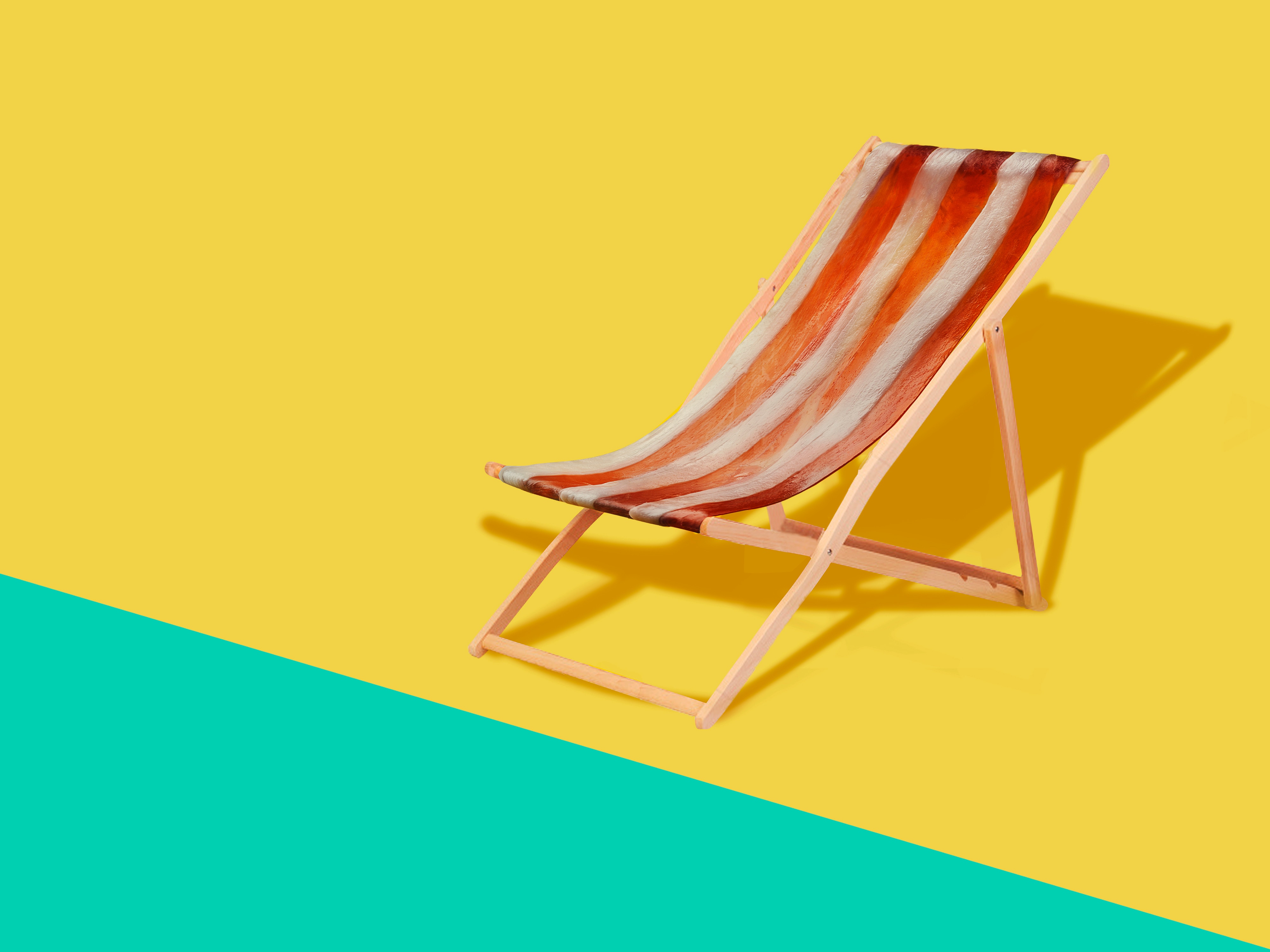 Striped deck chair on a yellow and teal background HD Wallpaper