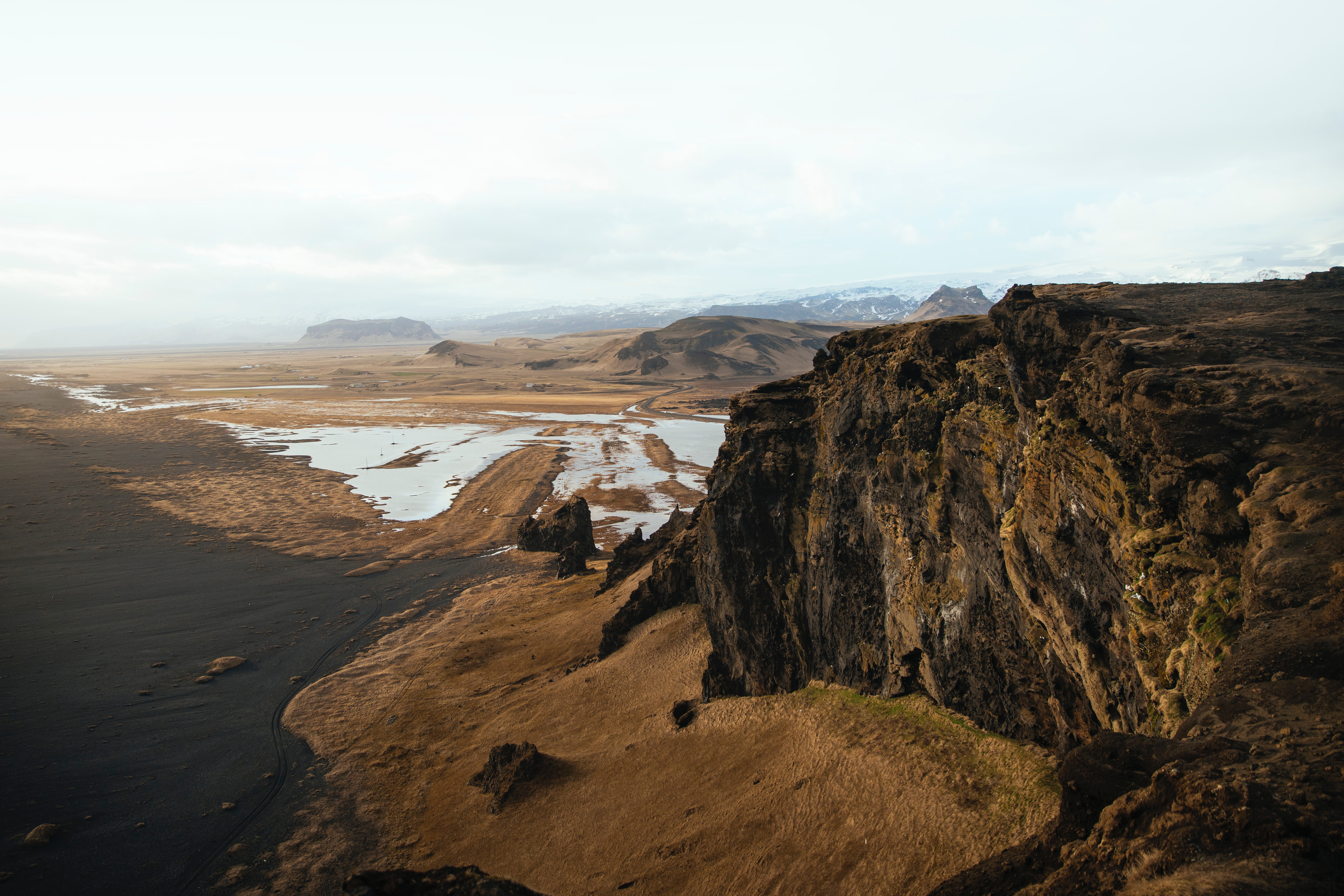 Black sand beach and cliffs in Iceland HD Wallpaper