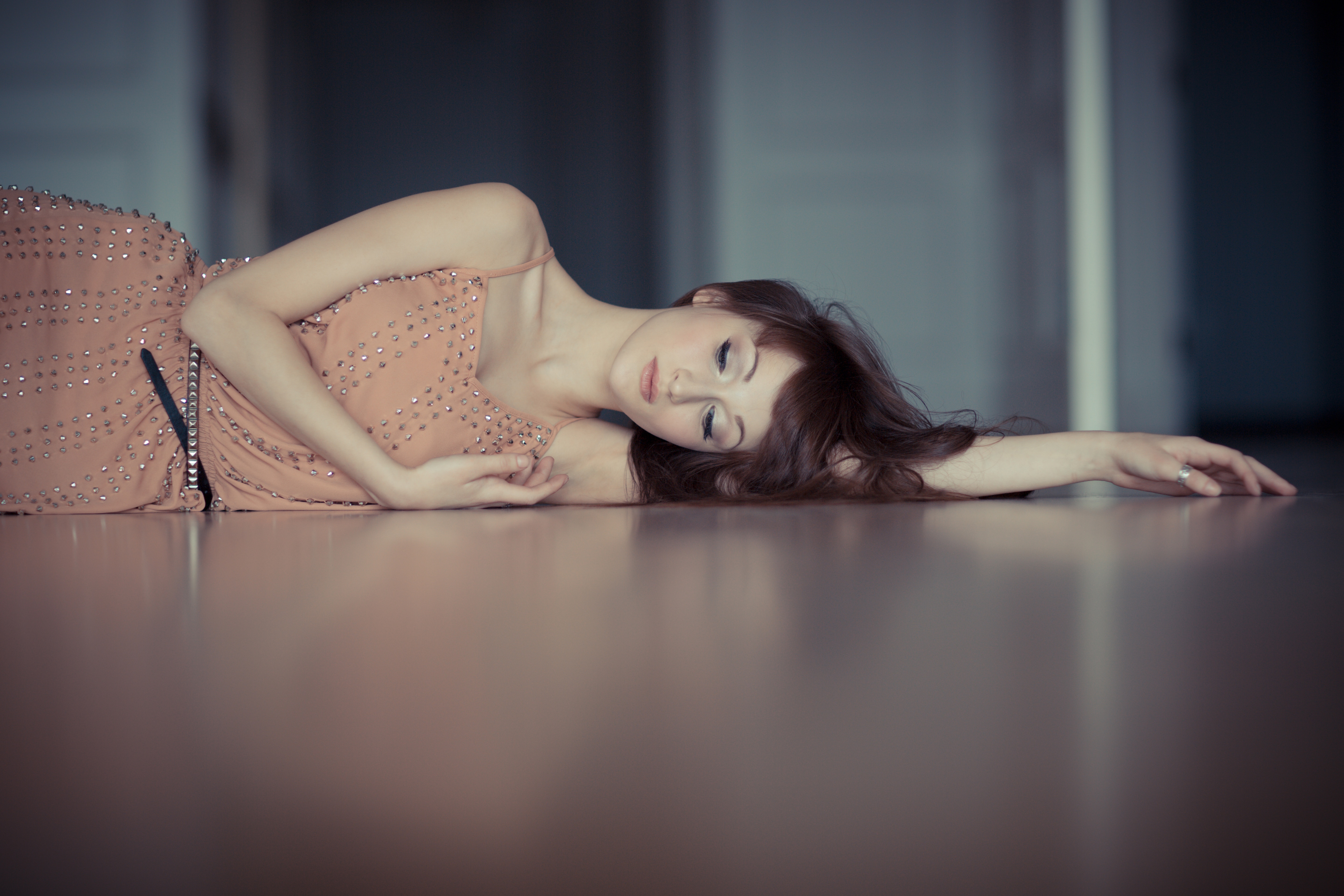 Woman laying on a wooden floor HD Wallpaper