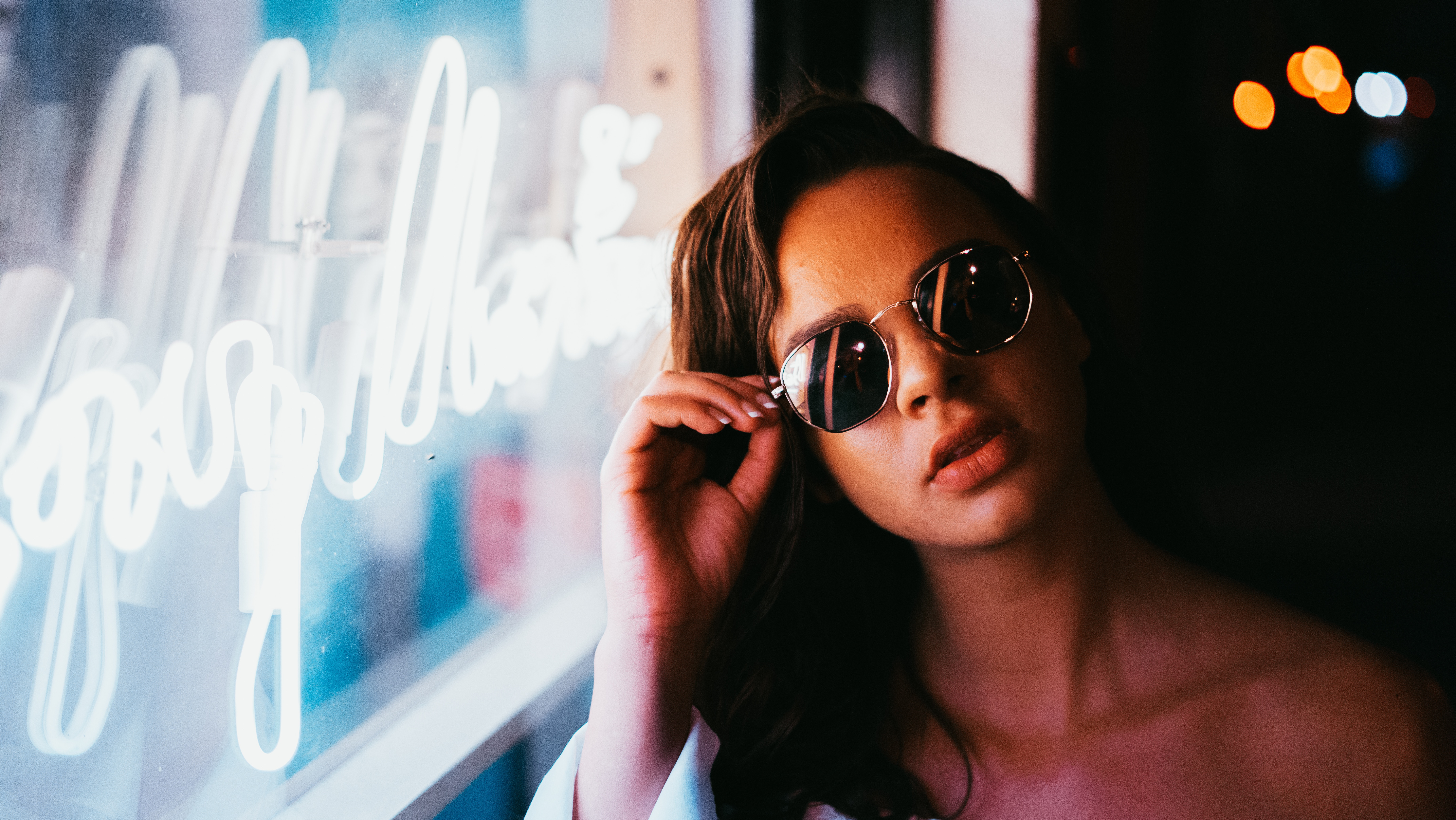 Woman with Sunglasses by Neon Window Light at Night HD Wallpaper