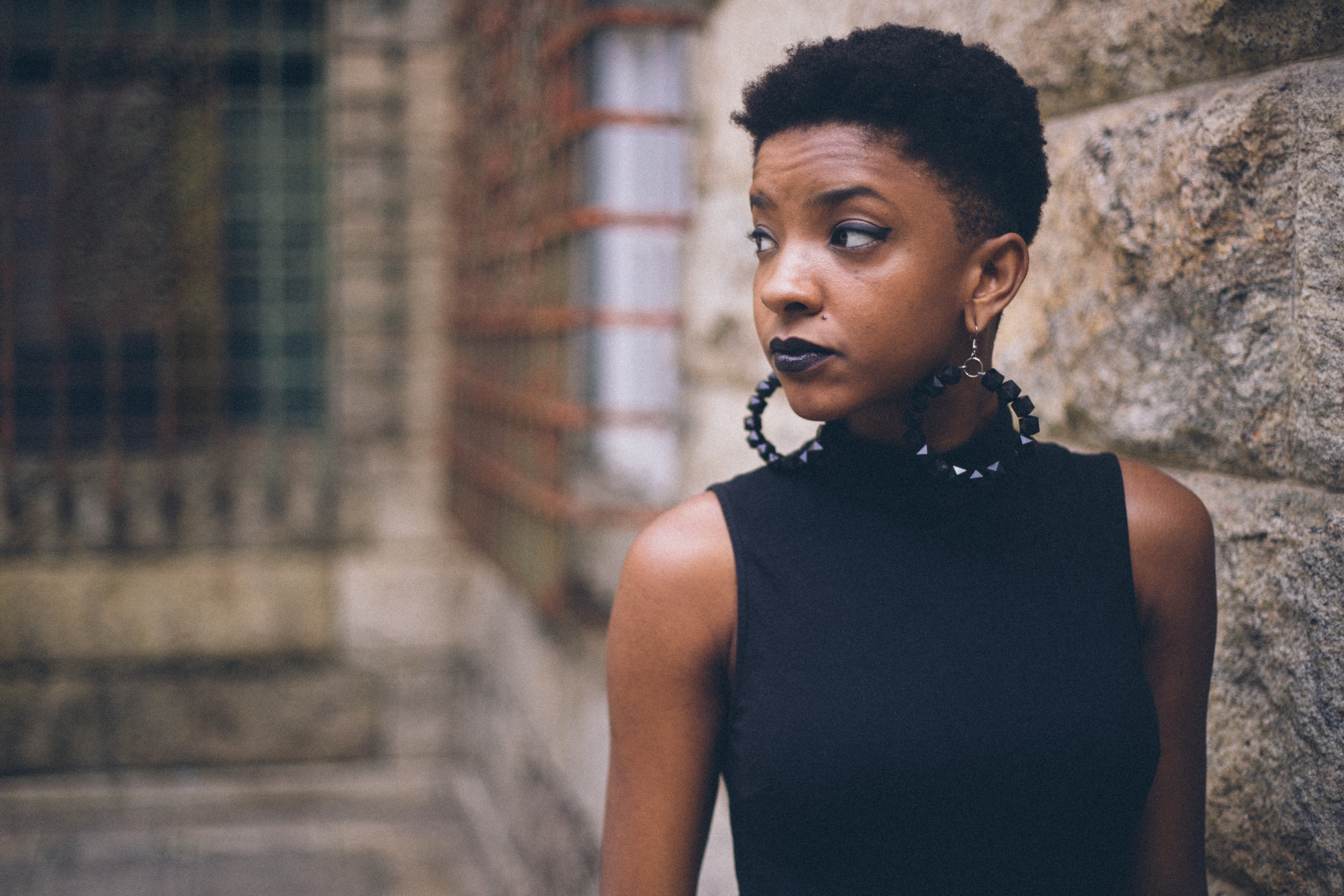 Black woman with short hair and large hoop earrings HD Wallpaper