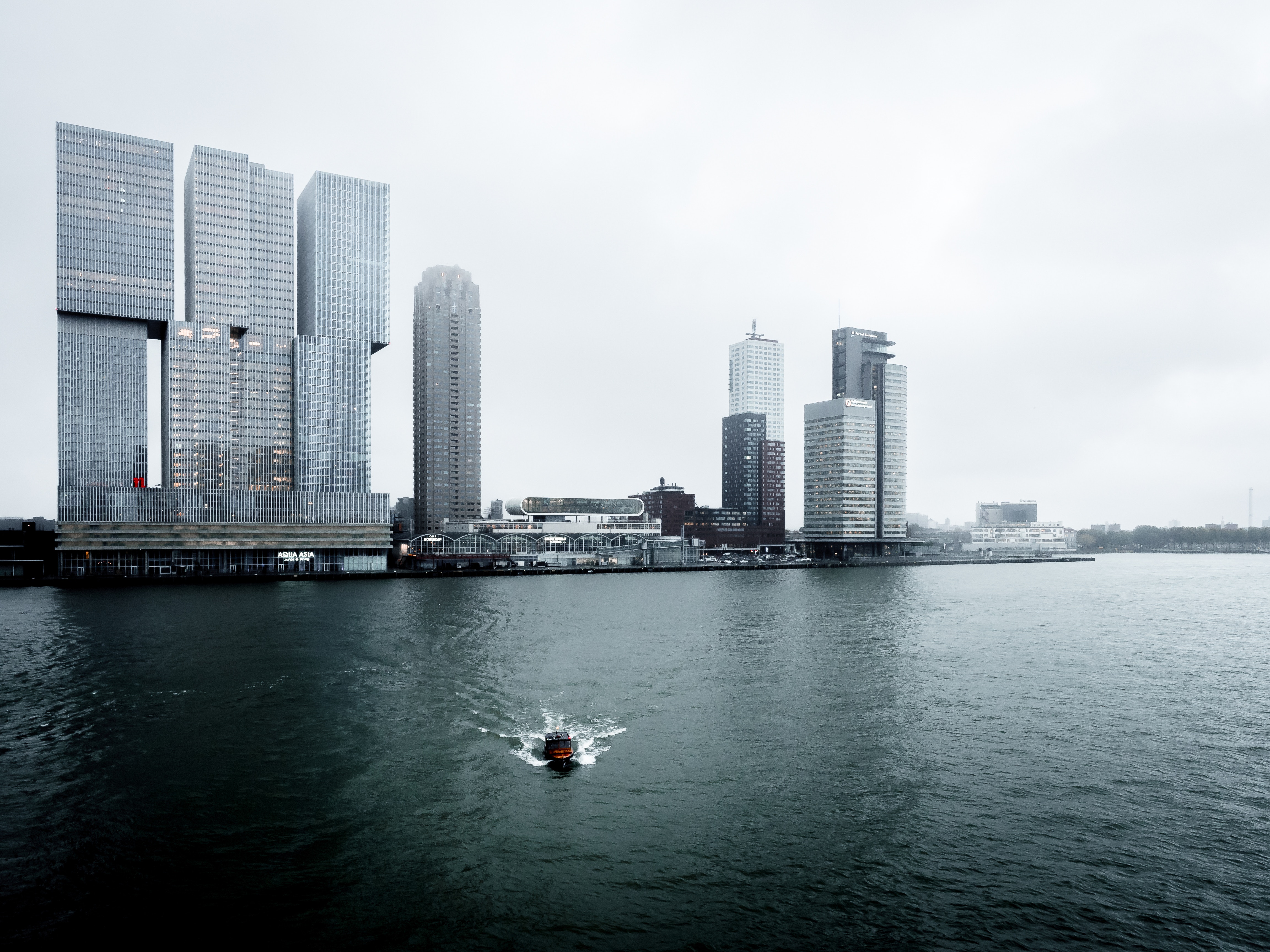 Rotterdam skyline with modern skyscrapers and a boat HD Wallpaper