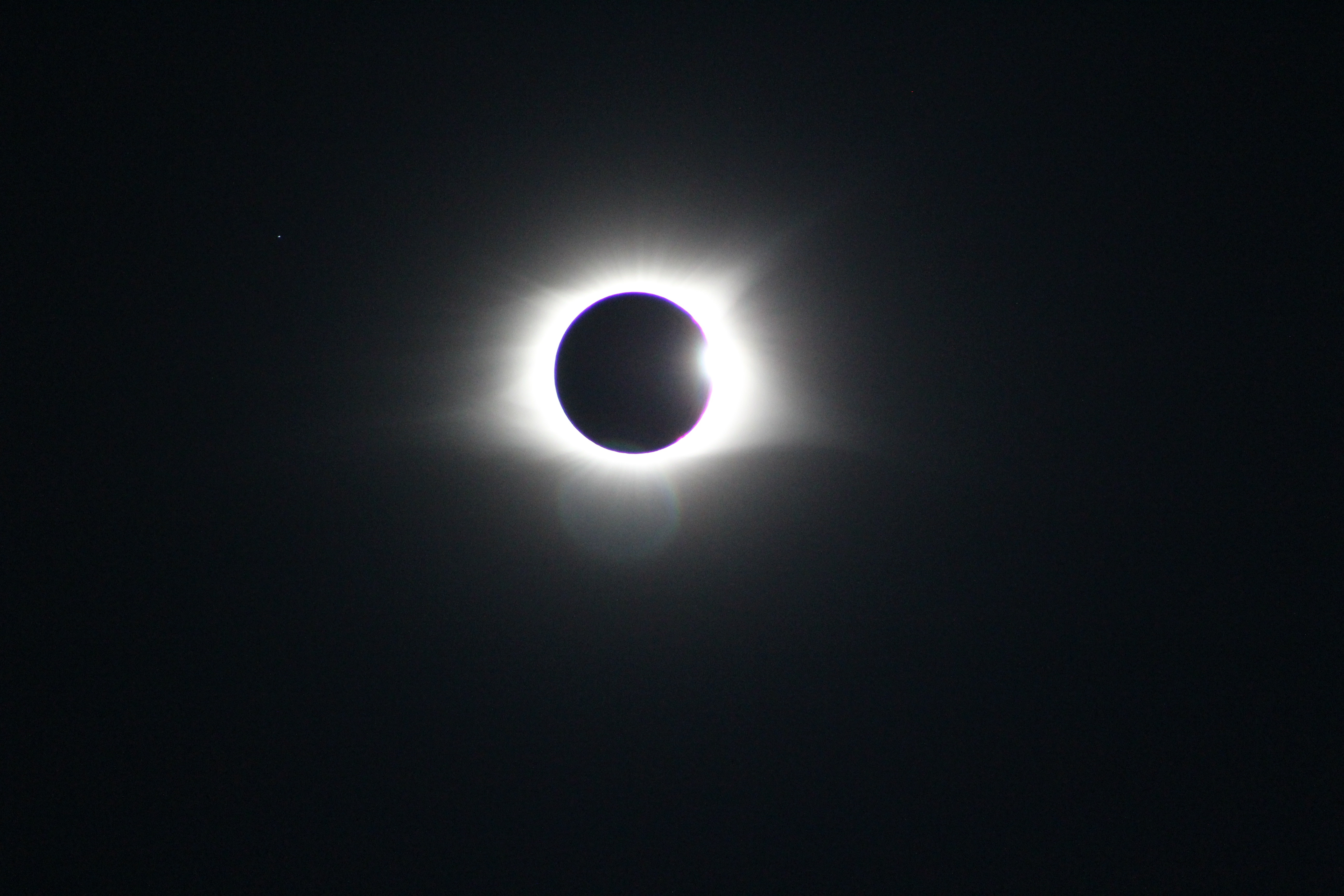 Total solar eclipse with corona and a small star HD Wallpaper