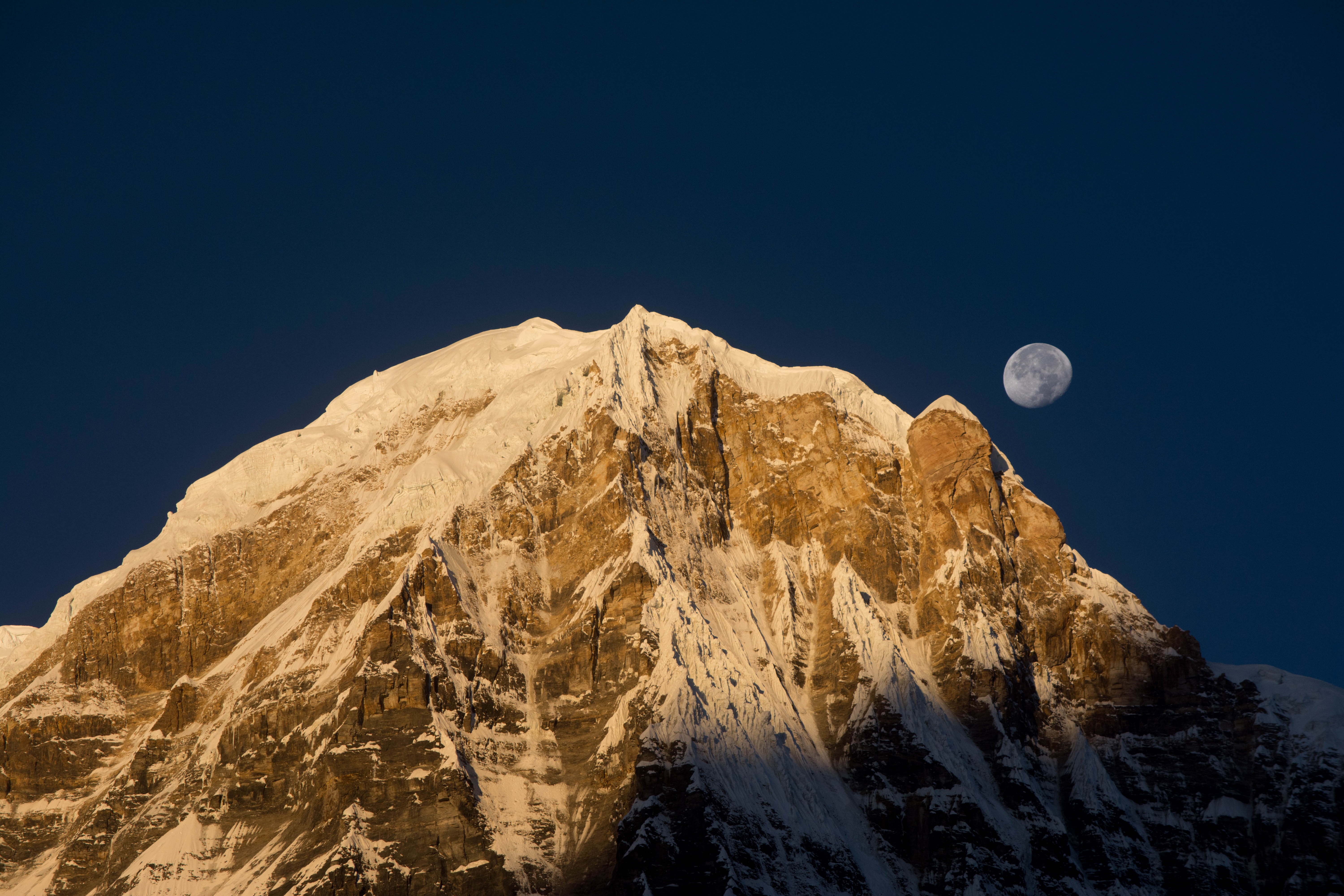 Annapurna mountain peak with moon in the sky HD Wallpaper