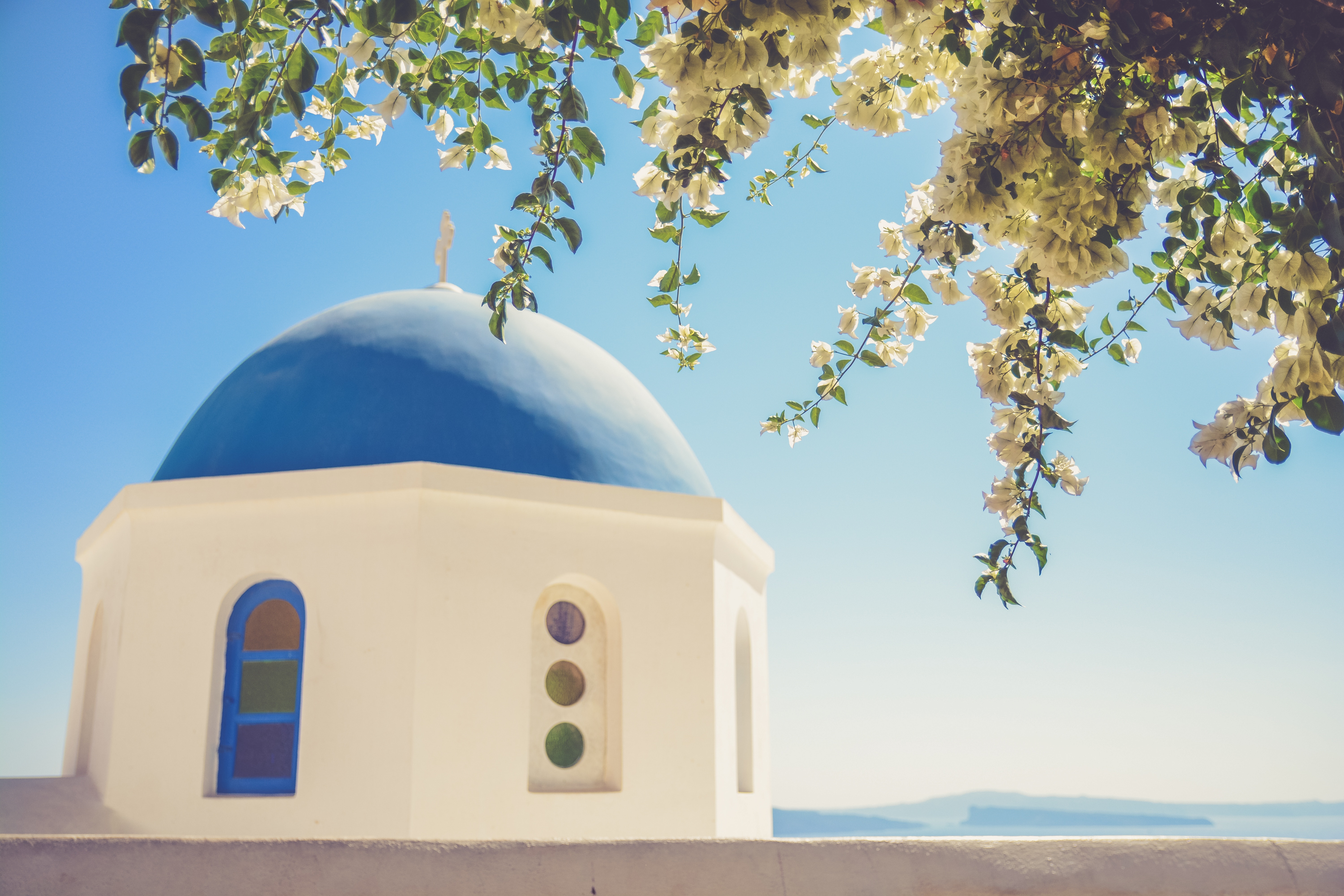 Blue dome church with white flowers and blue sky HD Wallpaper
