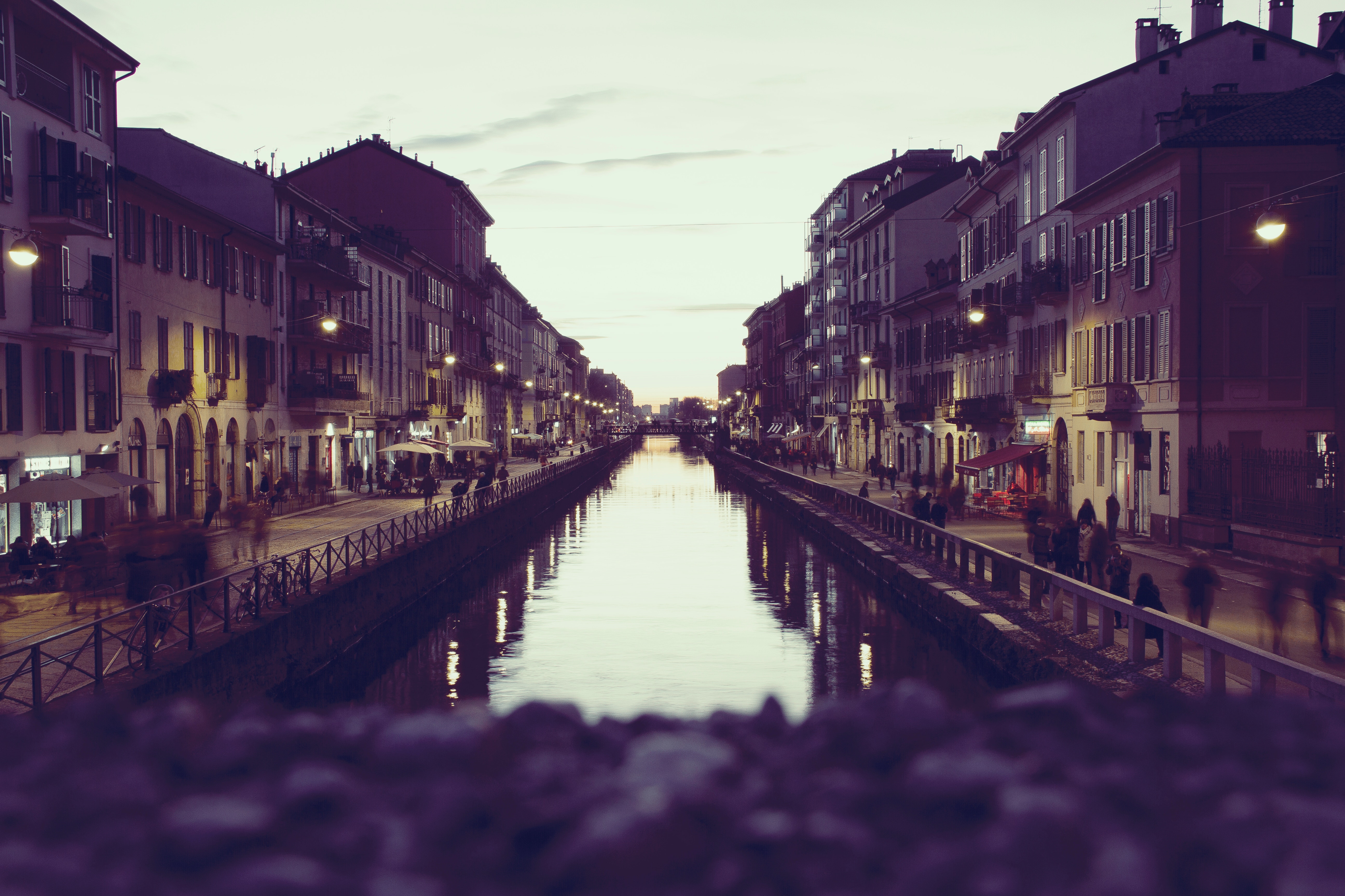 Canal in a city at dusk with buildings and reflections HD Wallpaper