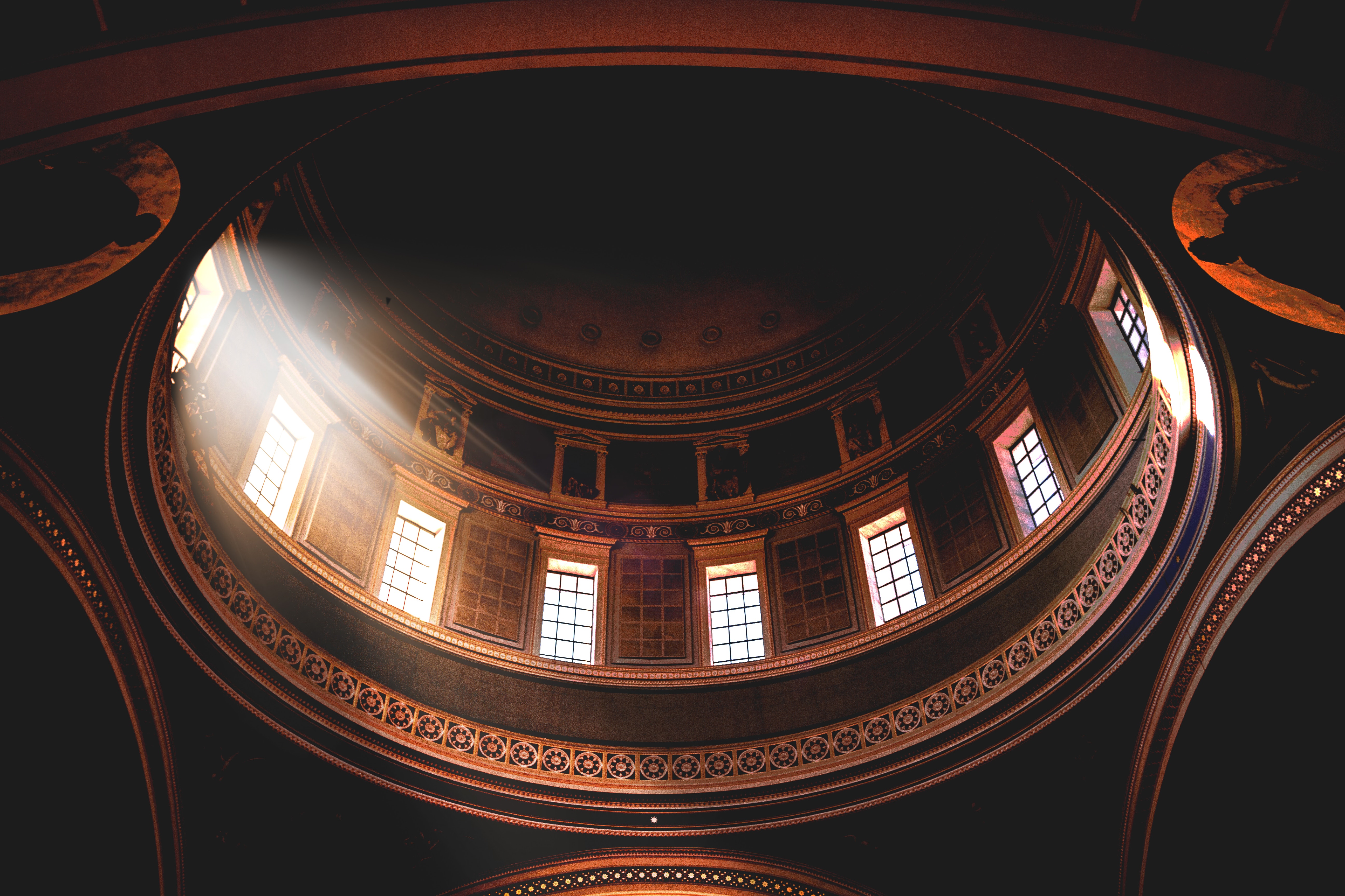Interior of a dome with sunlight streaming through windows HD Wallpaper