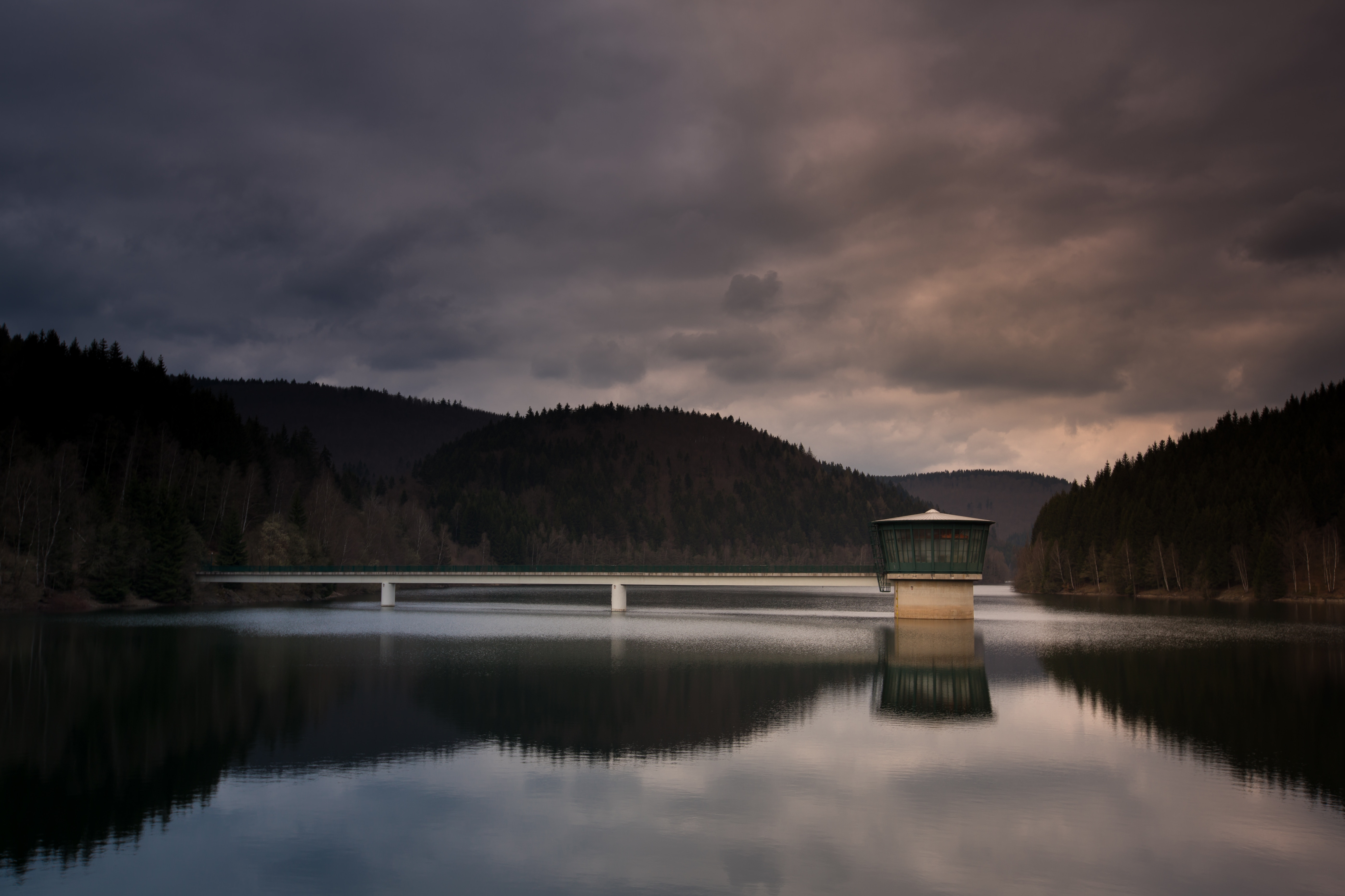 Dam with tower and bridge on a lake HD Wallpaper