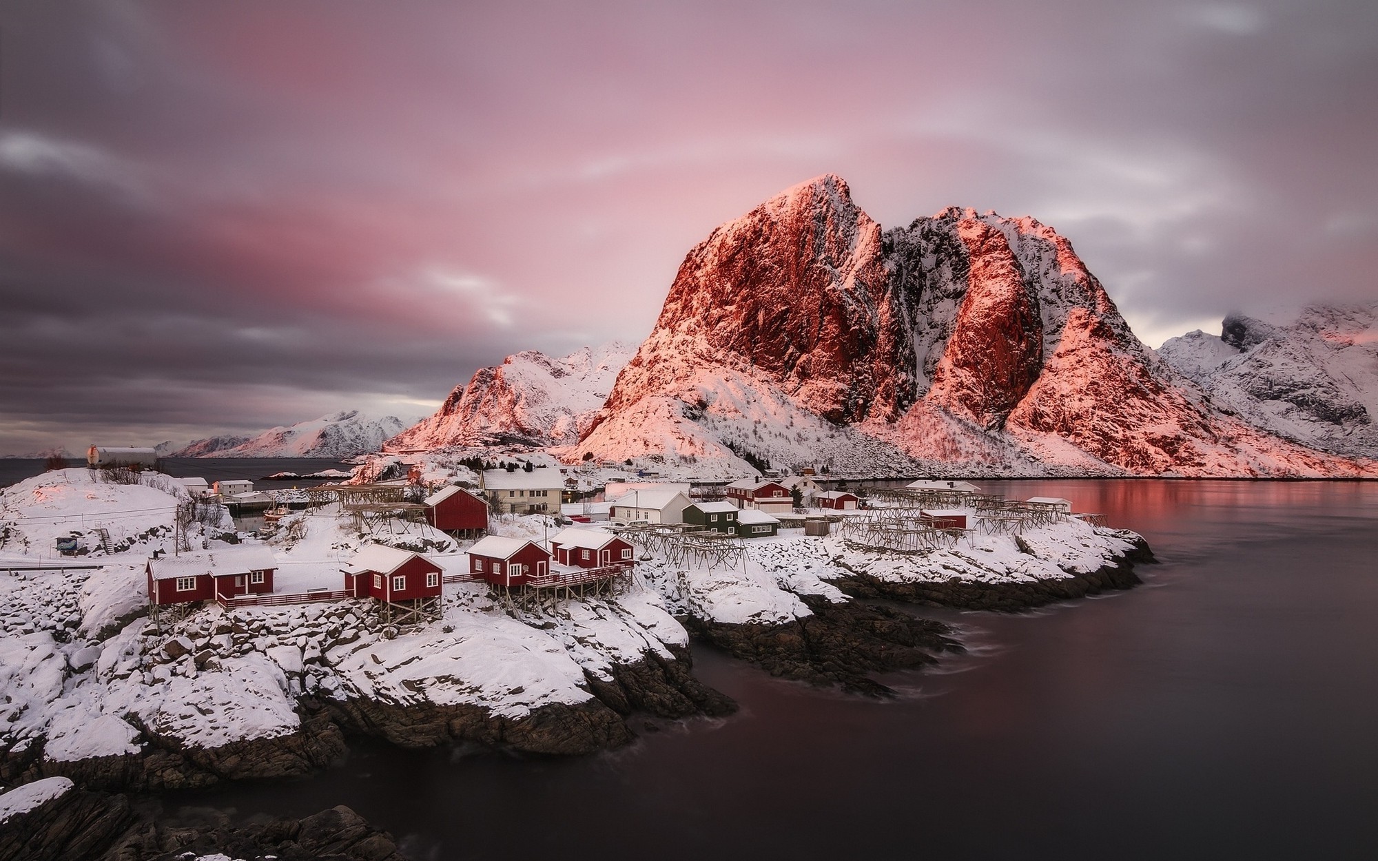 Winter sunrise over a Norwegian village and snowy mountains HD Wallpaper