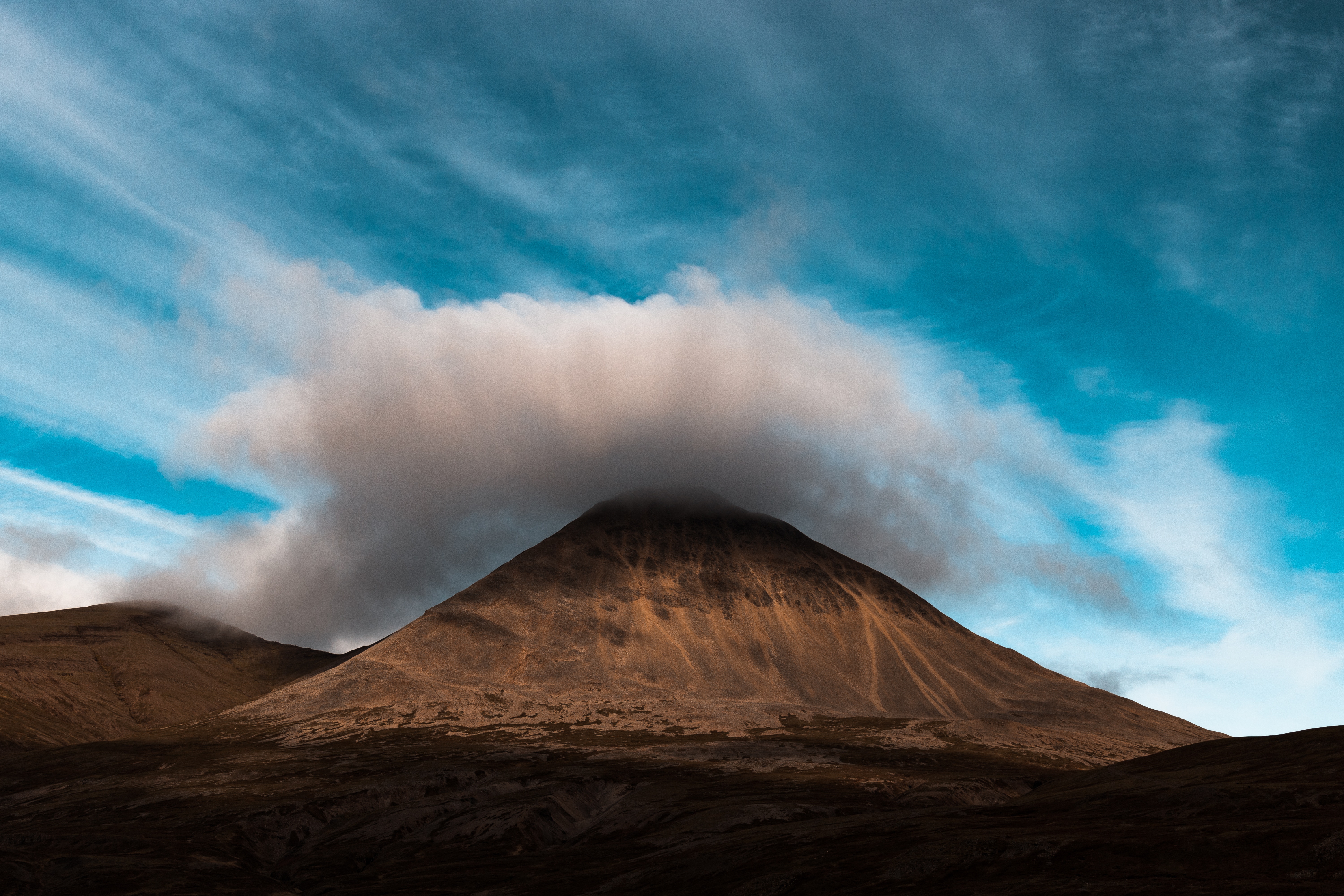 Mountain peak covered by clouds in Iceland HD Wallpaper